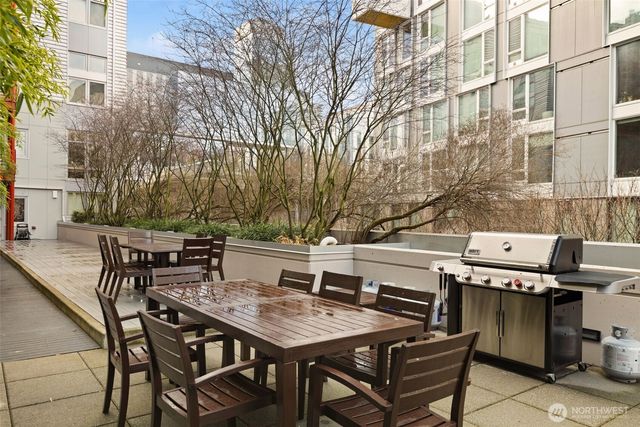 a view of a dinning table and chairs in the patio