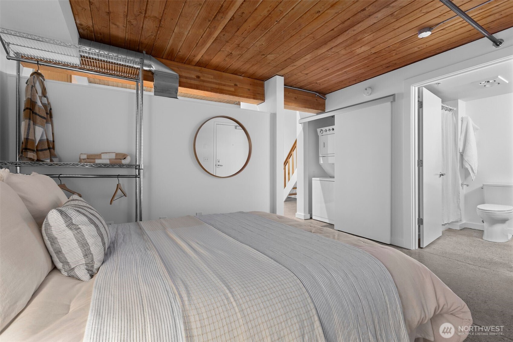 401 9th Avenue North, Unit 504 Seattle, WA 98109 - Photo 7 of 38 a bedroom with a bed mirror and window