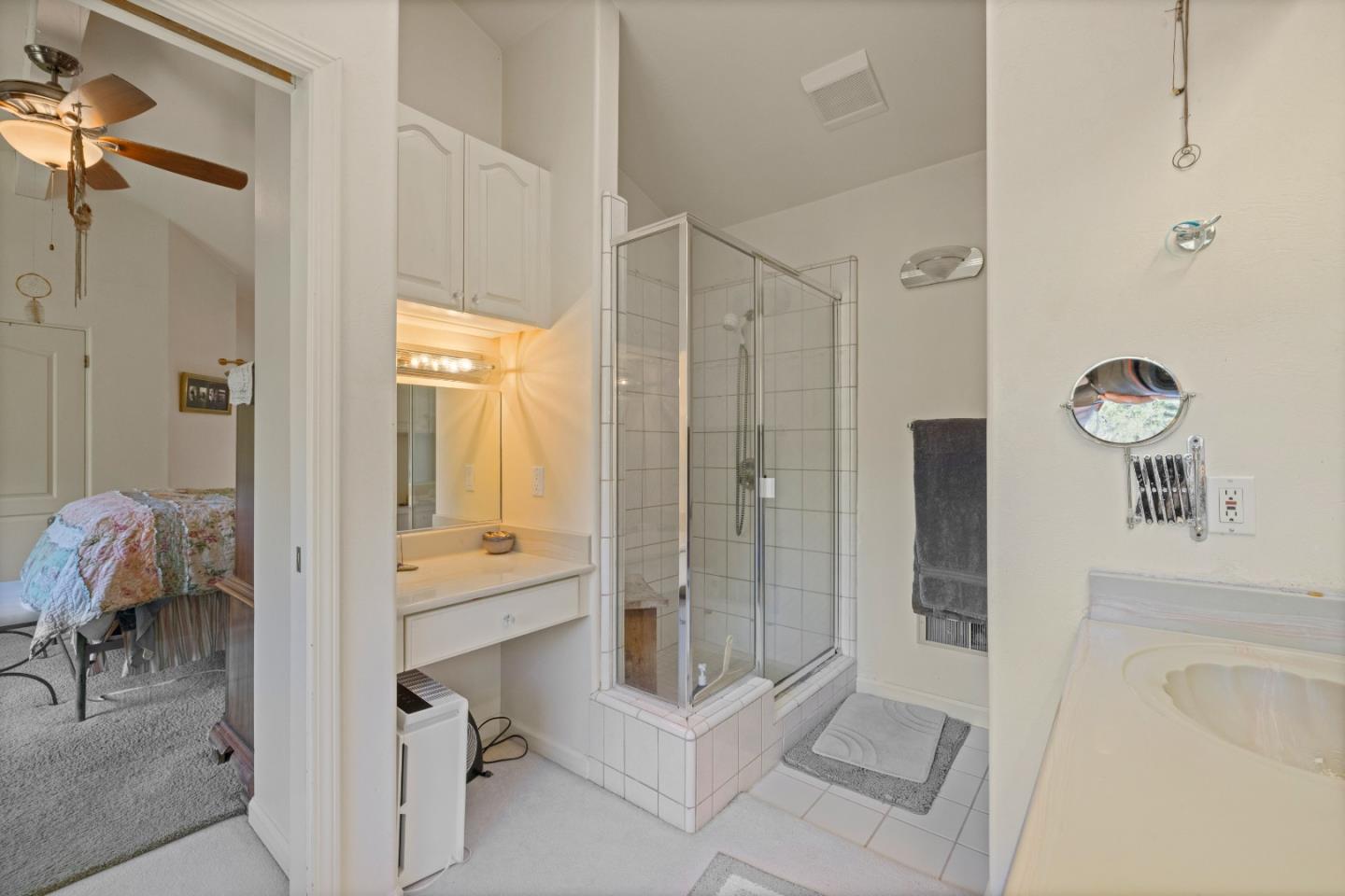 38621 Palo Colorado Road Carmel, CA 93923 - Photo 17 of 32 a bathroom with a tub shower and mirror
