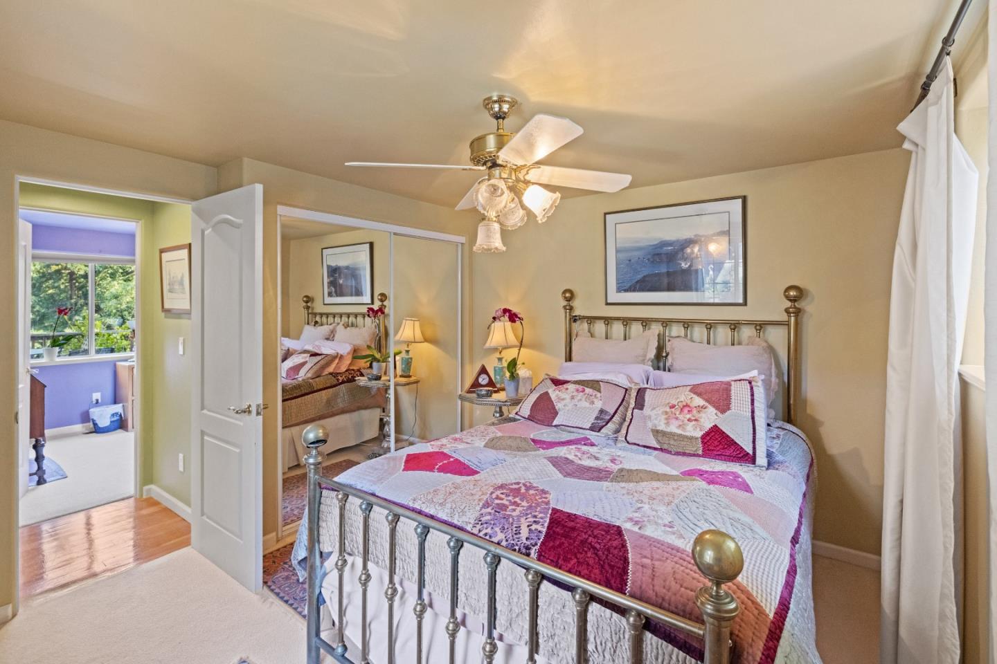 38621 Palo Colorado Road Carmel, CA 93923 - Photo 20 of 32 a bedroom with a bed and a chandelier