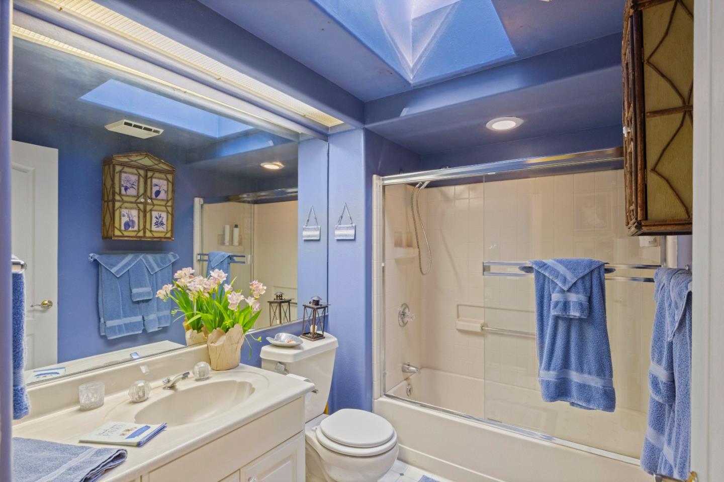 38621 Palo Colorado Road Carmel, CA 93923 - Photo 21 of 32 a bathroom with a granite countertop sink a toilet and shower