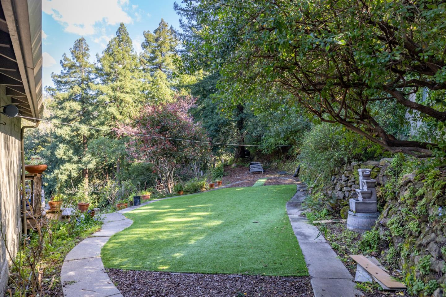 38621 Palo Colorado Road Carmel, CA 93923 - Photo 26 of 32 a view of a garden with a fountain