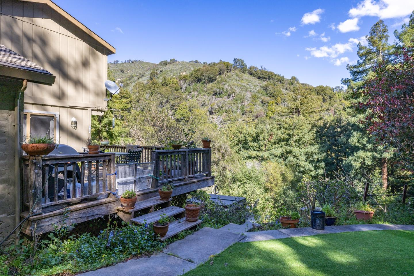 38621 Palo Colorado Road Carmel, CA 93923 - Photo 27 of 32 a view of a chair and tables in the backyard of the house