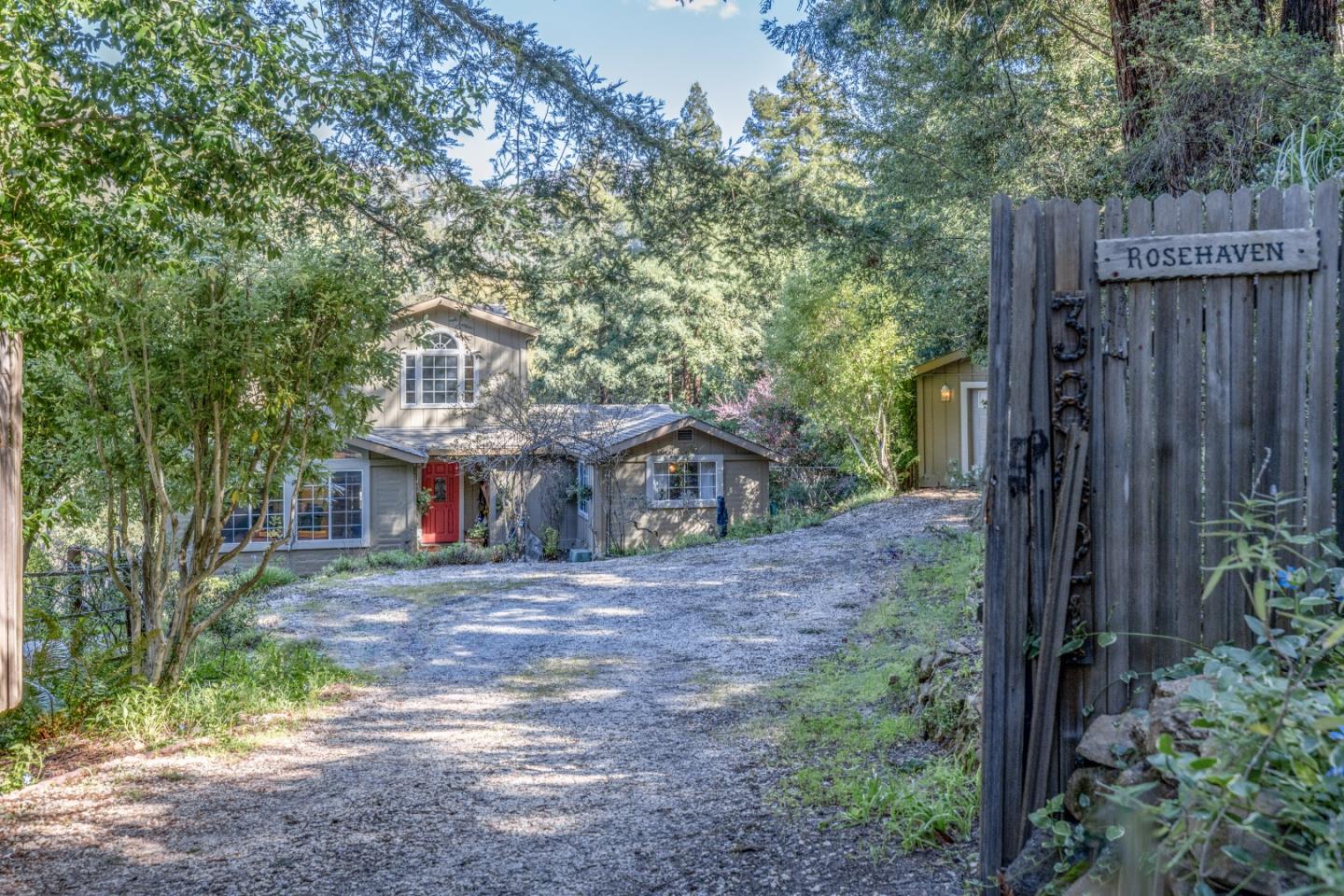 38621 Palo Colorado Road Carmel, CA 93923 - Photo 31 of 32 a view of a house with a yard and large tree