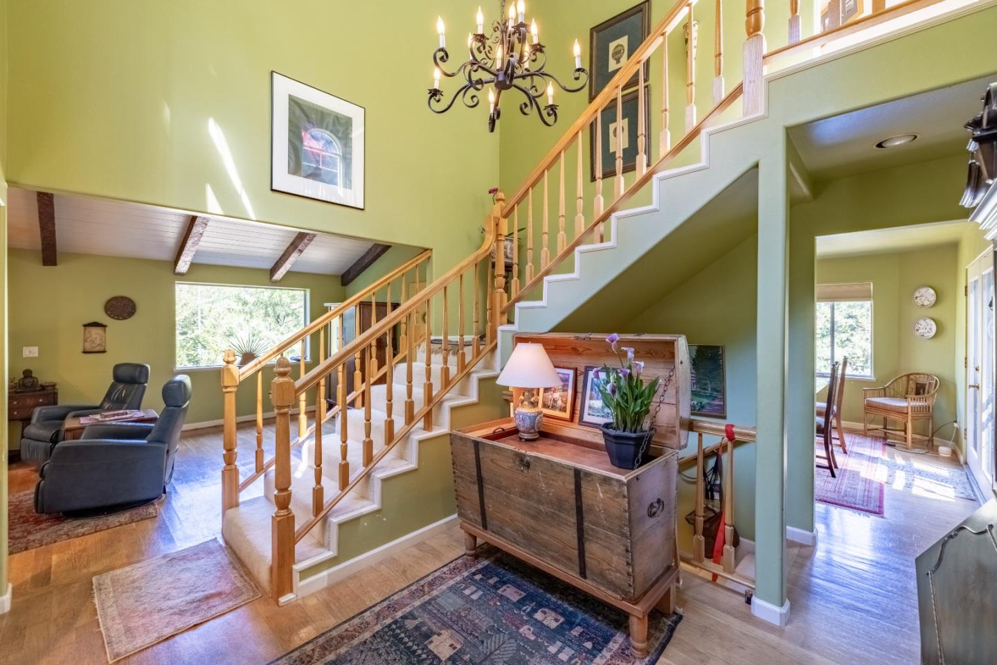 38621 Palo Colorado Road Carmel, CA 93923 - Photo 4 of 32 a view of staircase with furniture and a chandelier