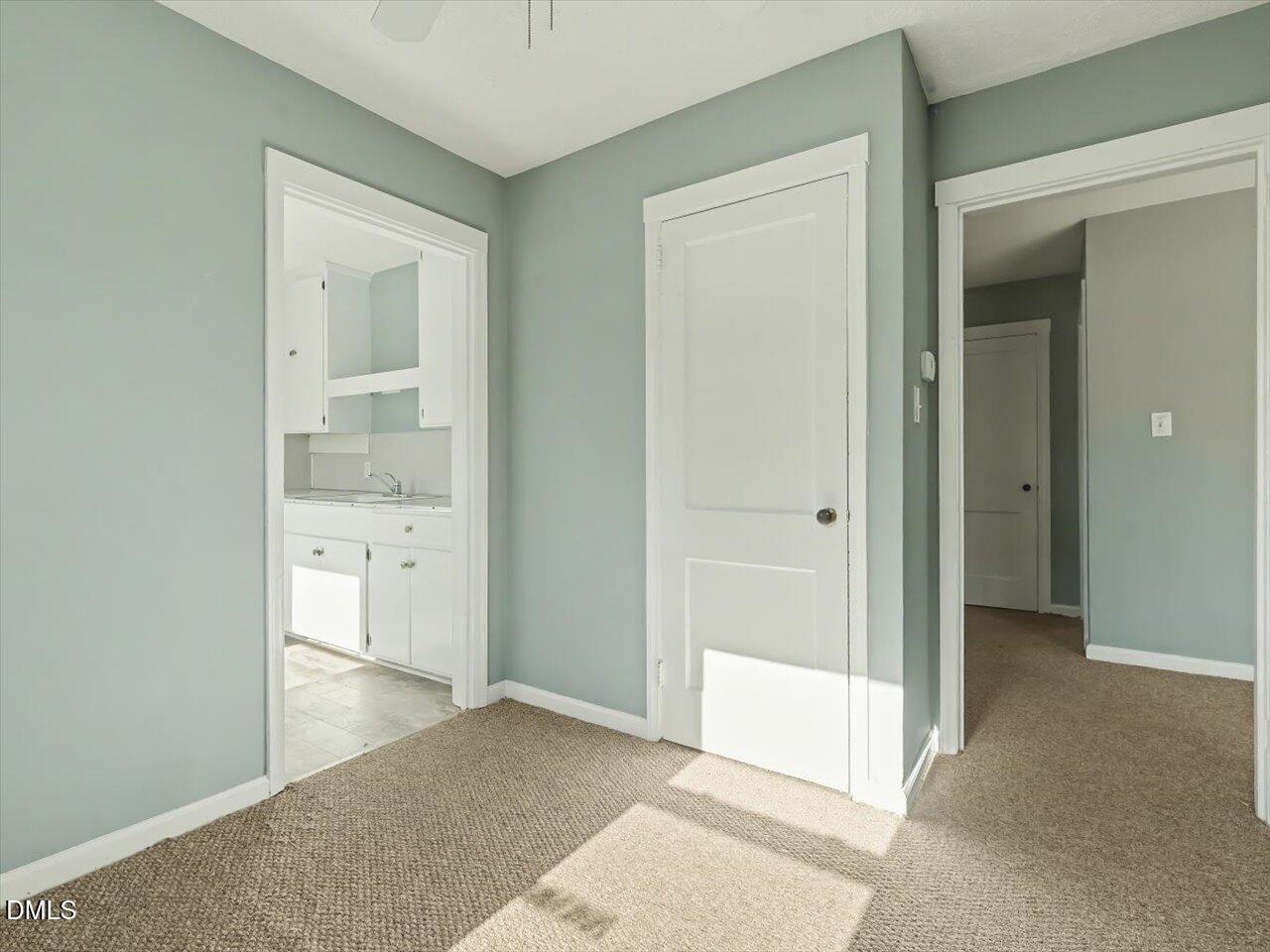 1501 Fairfax Road Durham, NC 27701 - Photo 15 of 42 a view of a bathroom with a glass door and a bathroom sink