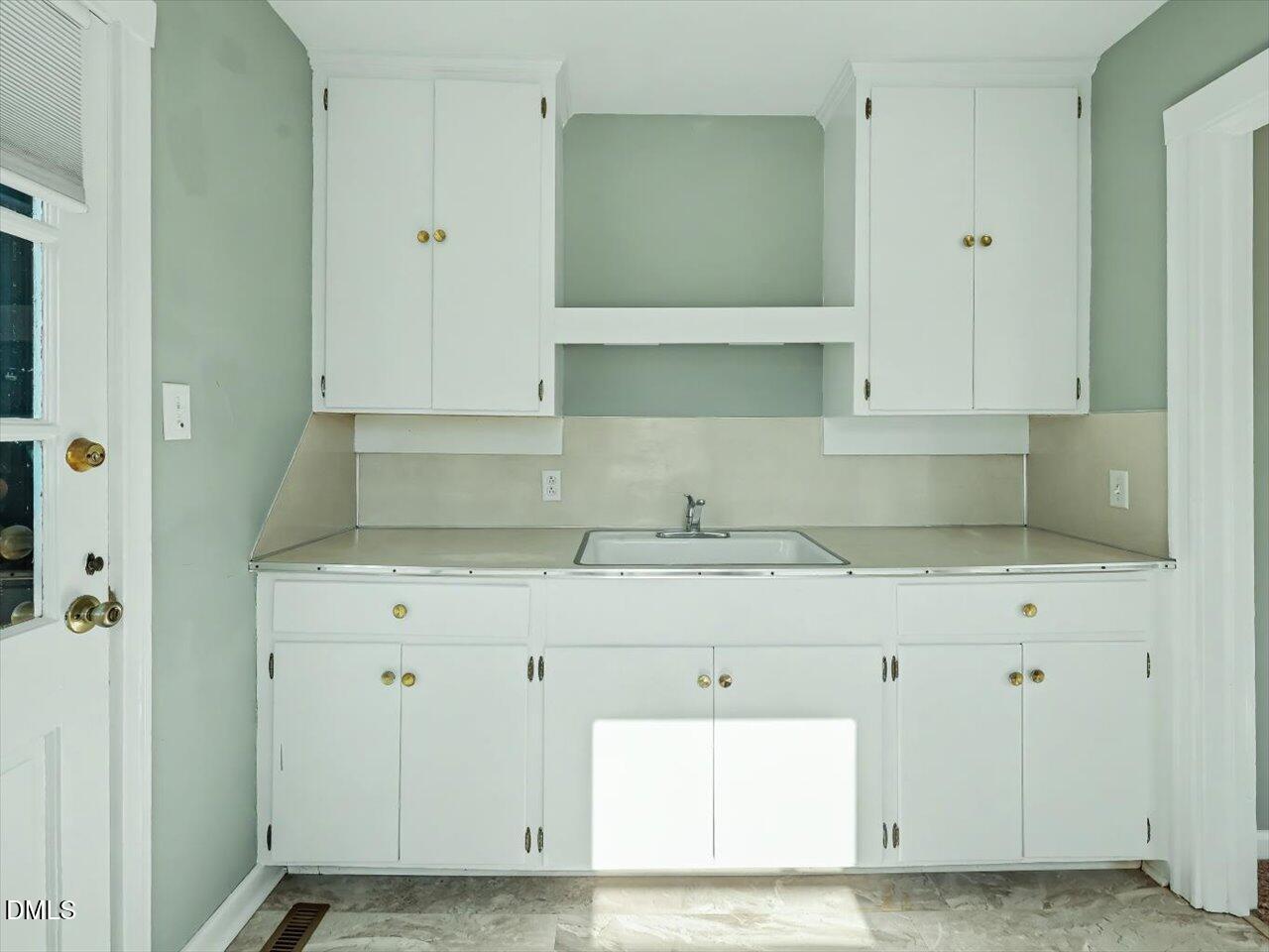 1501 Fairfax Road Durham, NC 27701 - Photo 18 of 42 a view of cabinets and wooden floor