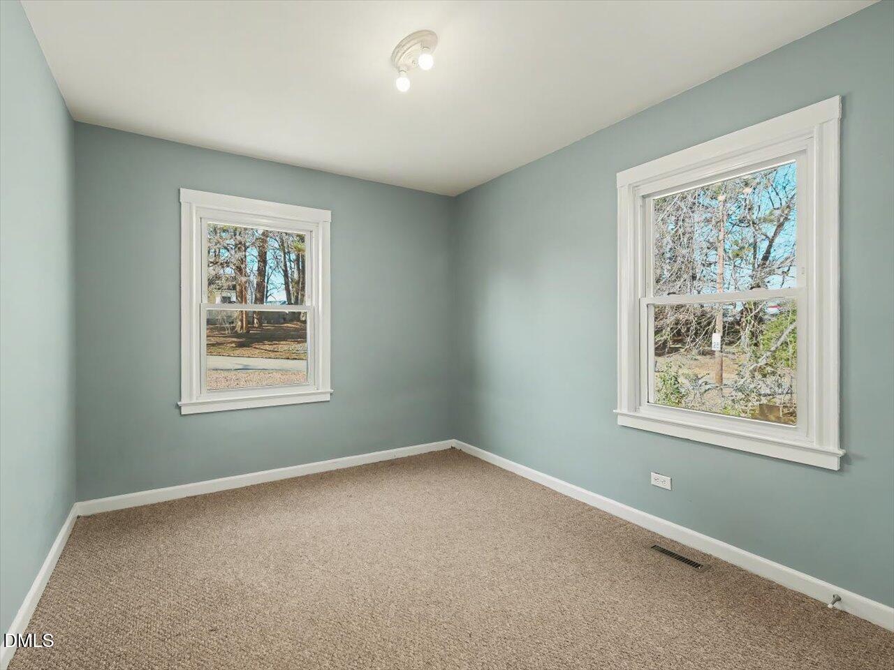 1501 Fairfax Road Durham, NC 27701 - Photo 20 of 42 an empty room with windows