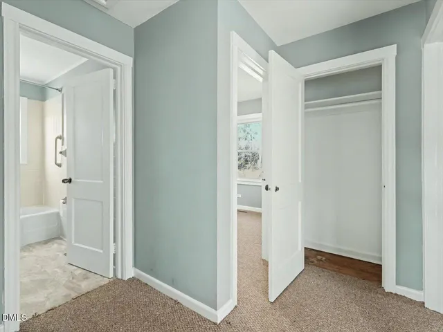 a view of an empty room with a window