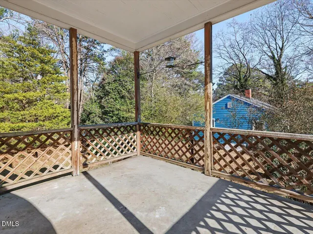 a view of a roof deck with wooden floor and fence