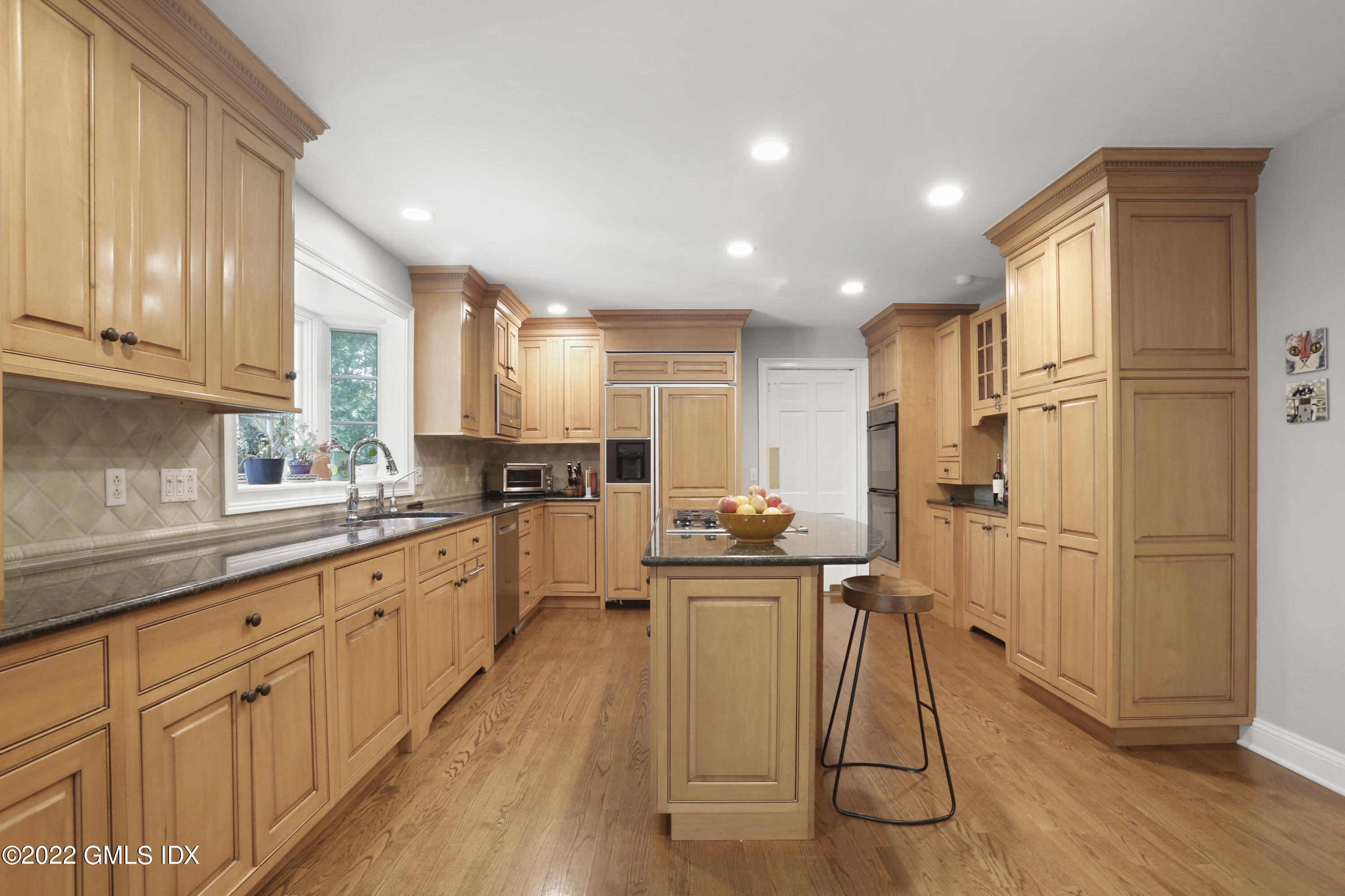 9 Frontier Road Cos Cob, CT 06807 - Photo 11 of 37 a kitchen with sink cabinets and wooden floor