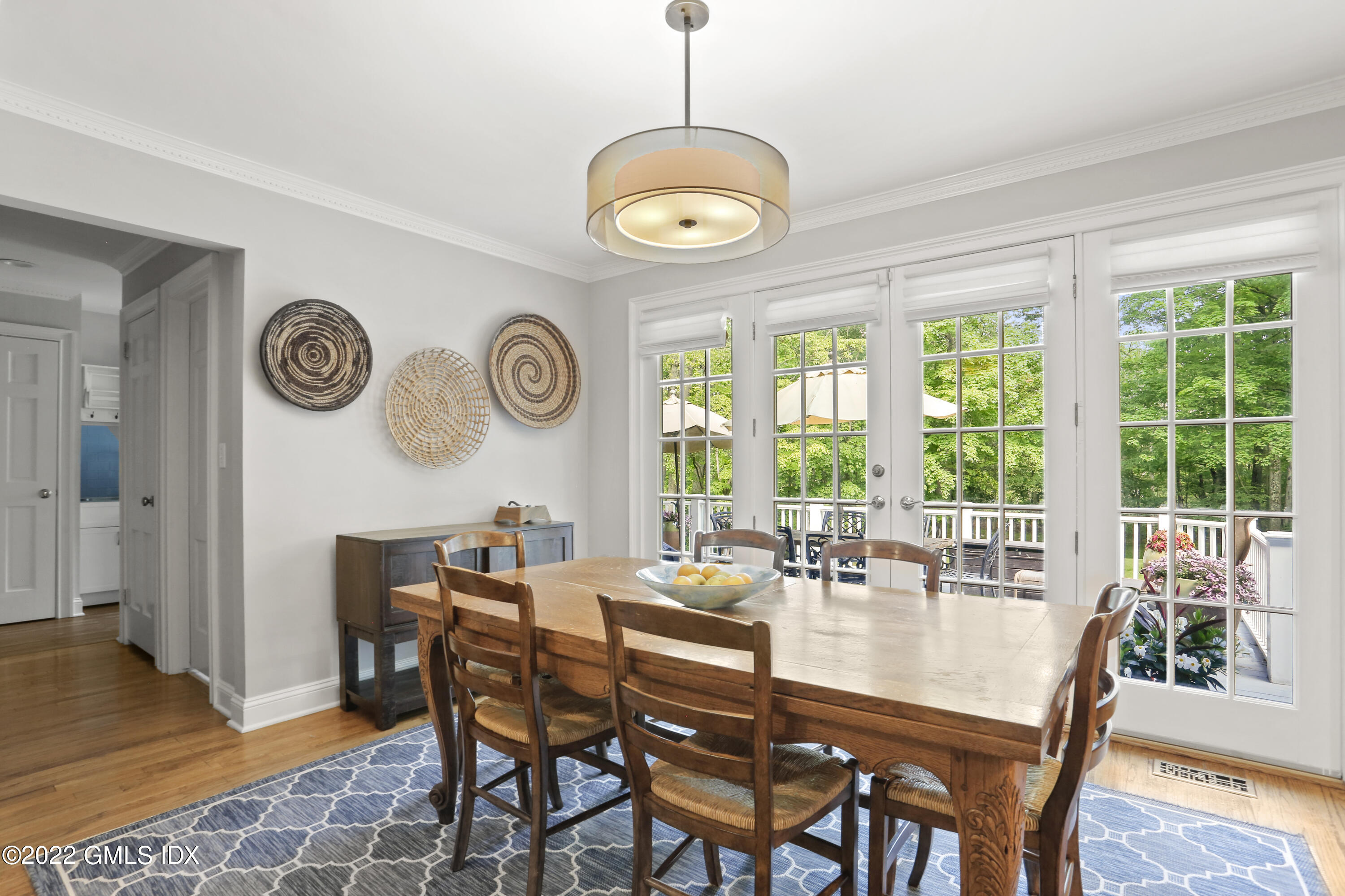 9 Frontier Road Cos Cob, CT 06807 - Photo 12 of 37 a dining room with furniture a rug and a large window