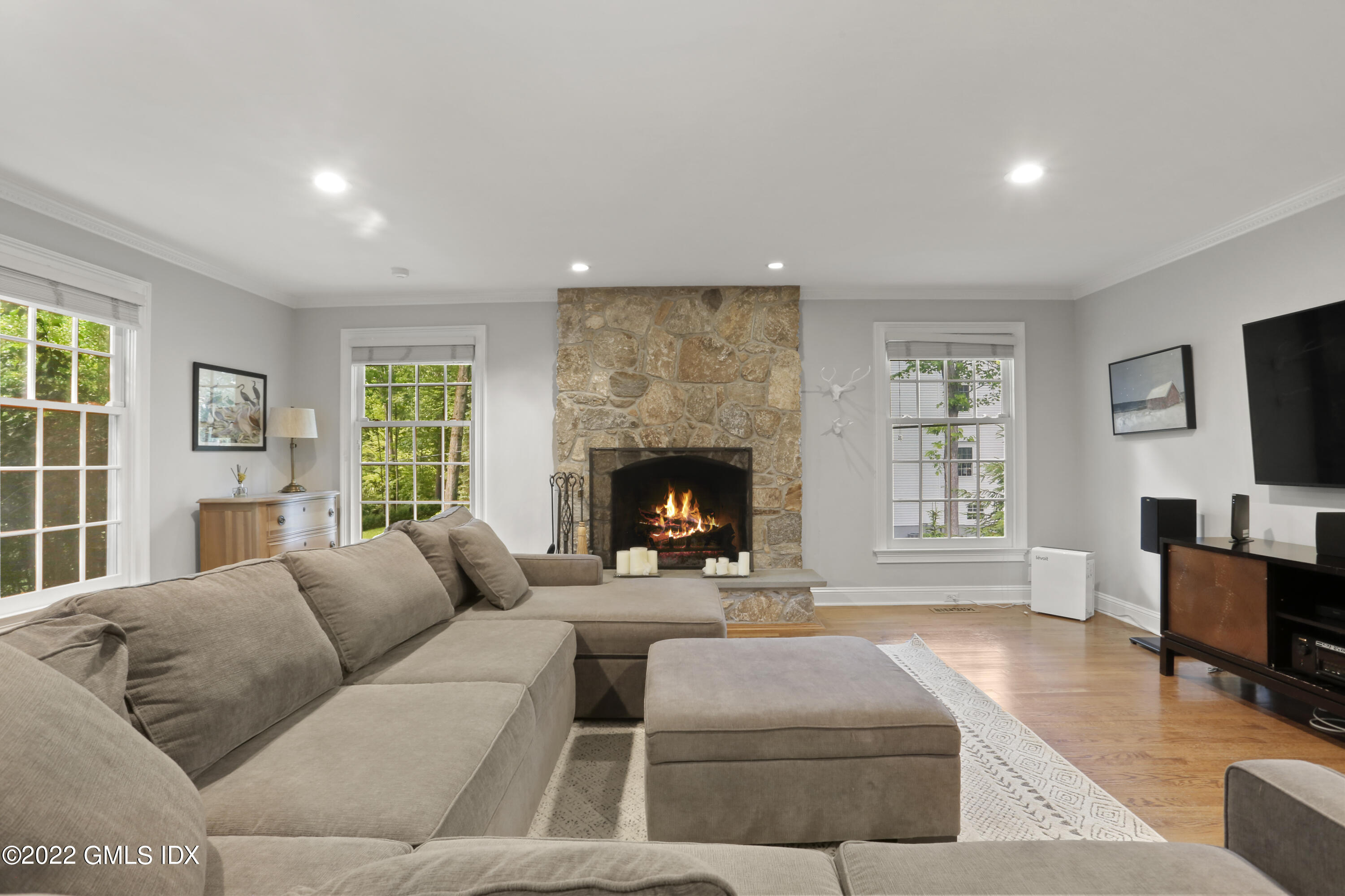 9 Frontier Road Cos Cob, CT 06807 - Photo 13 of 37 a living room with furniture window and a fireplace