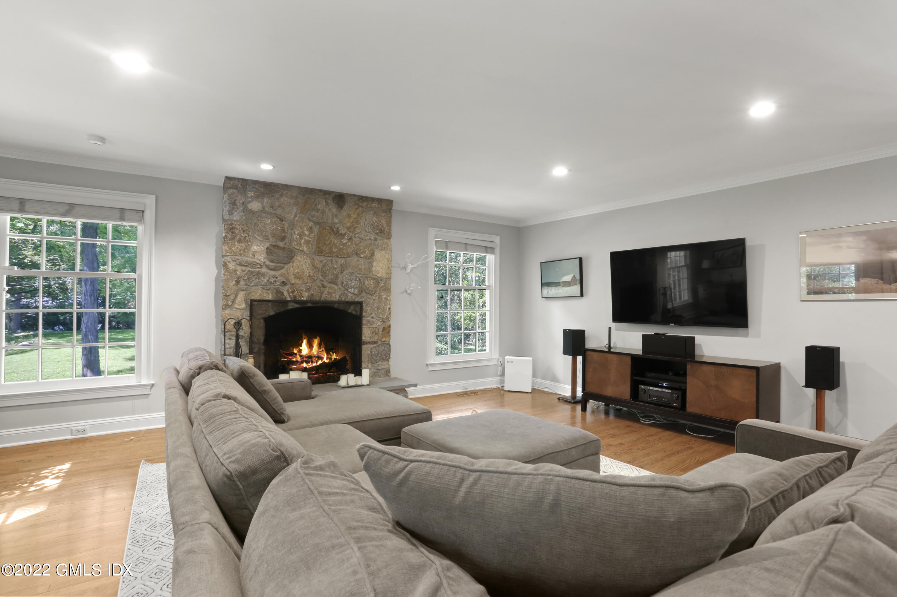9 Frontier Road Cos Cob, CT 06807 - Photo 16 of 37 a living room with furniture and a flat screen tv