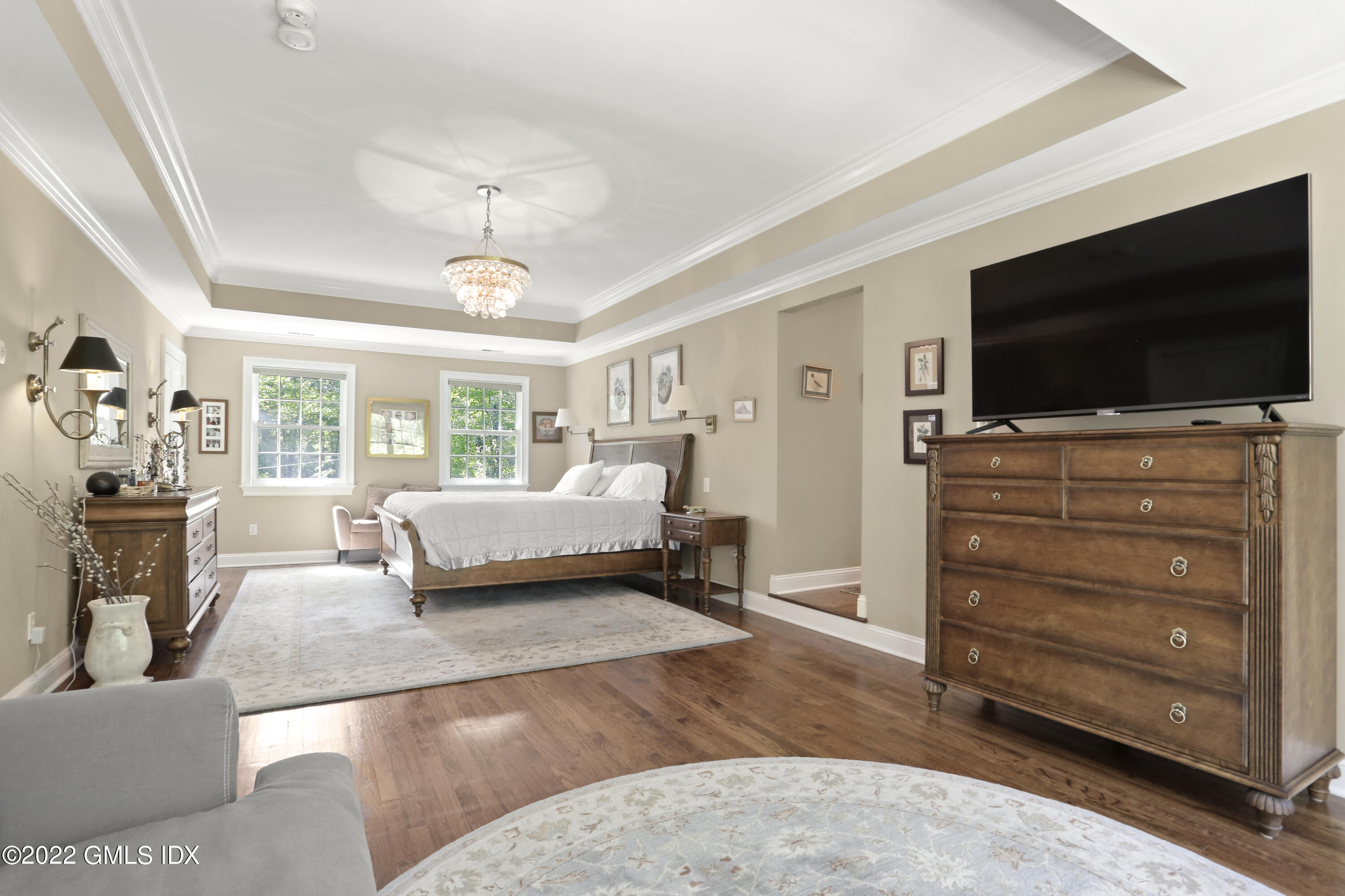 9 Frontier Road Cos Cob, CT 06807 - Photo 17 of 37 a bedroom with a bed and flat screen tv