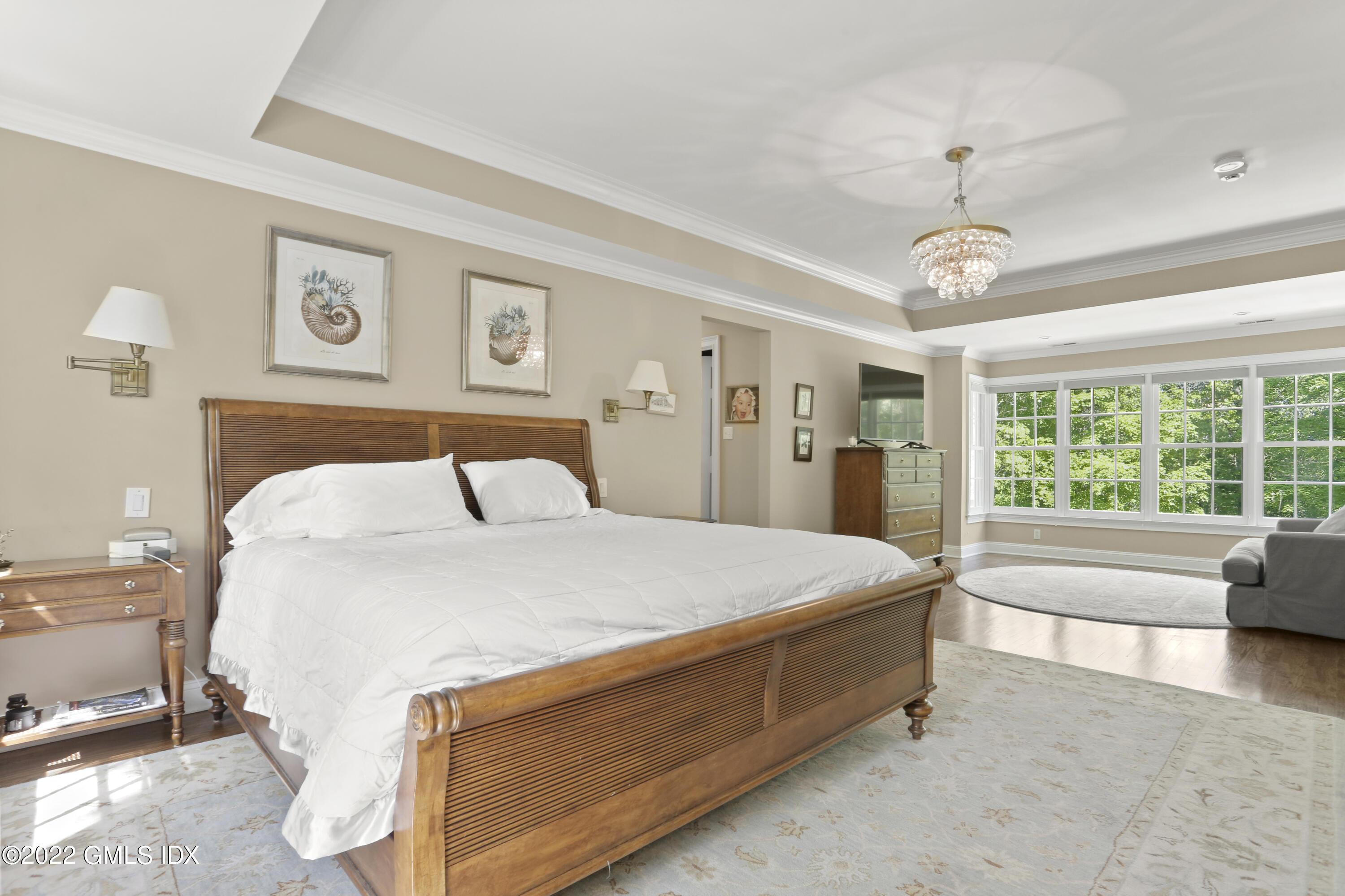 9 Frontier Road Cos Cob, CT 06807 - Photo 18 of 37 a spacious bedroom with a bed and a large window