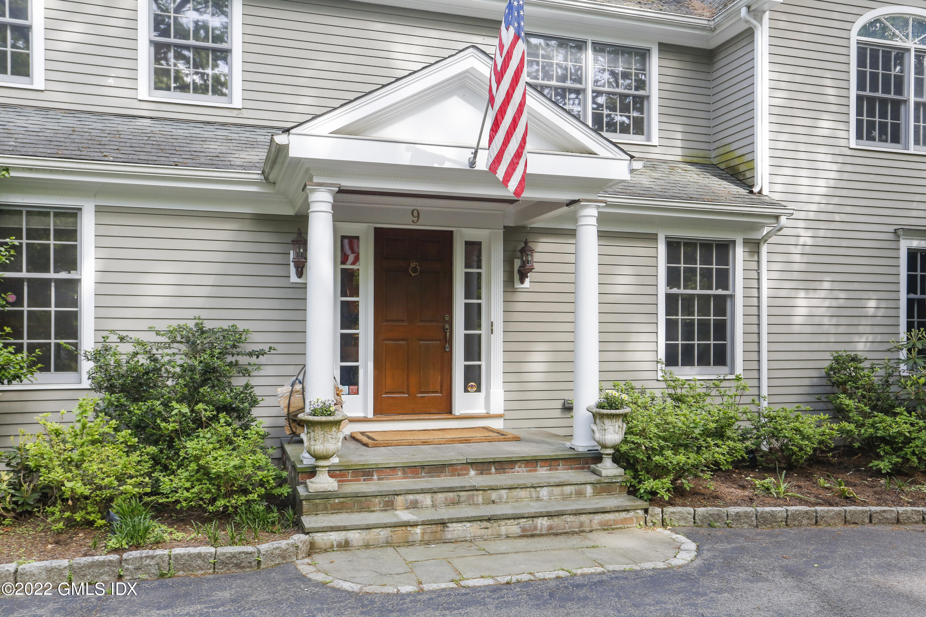 9 Frontier Road Cos Cob, CT 06807 - Photo 2 of 37 a view of a house with entrance and windows