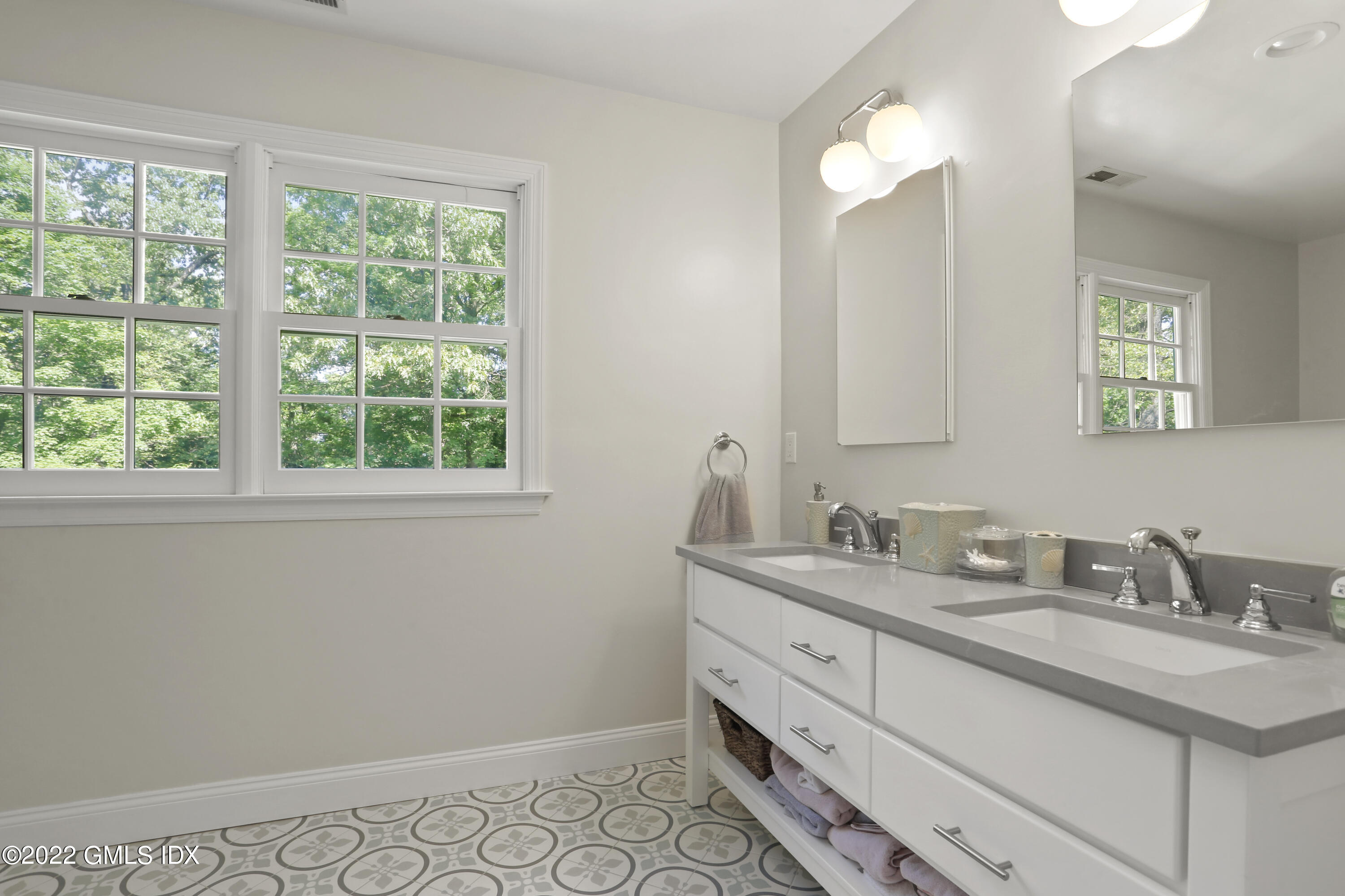 9 Frontier Road Cos Cob, CT 06807 - Photo 23 of 37 a bathroom with a sink and a mirror