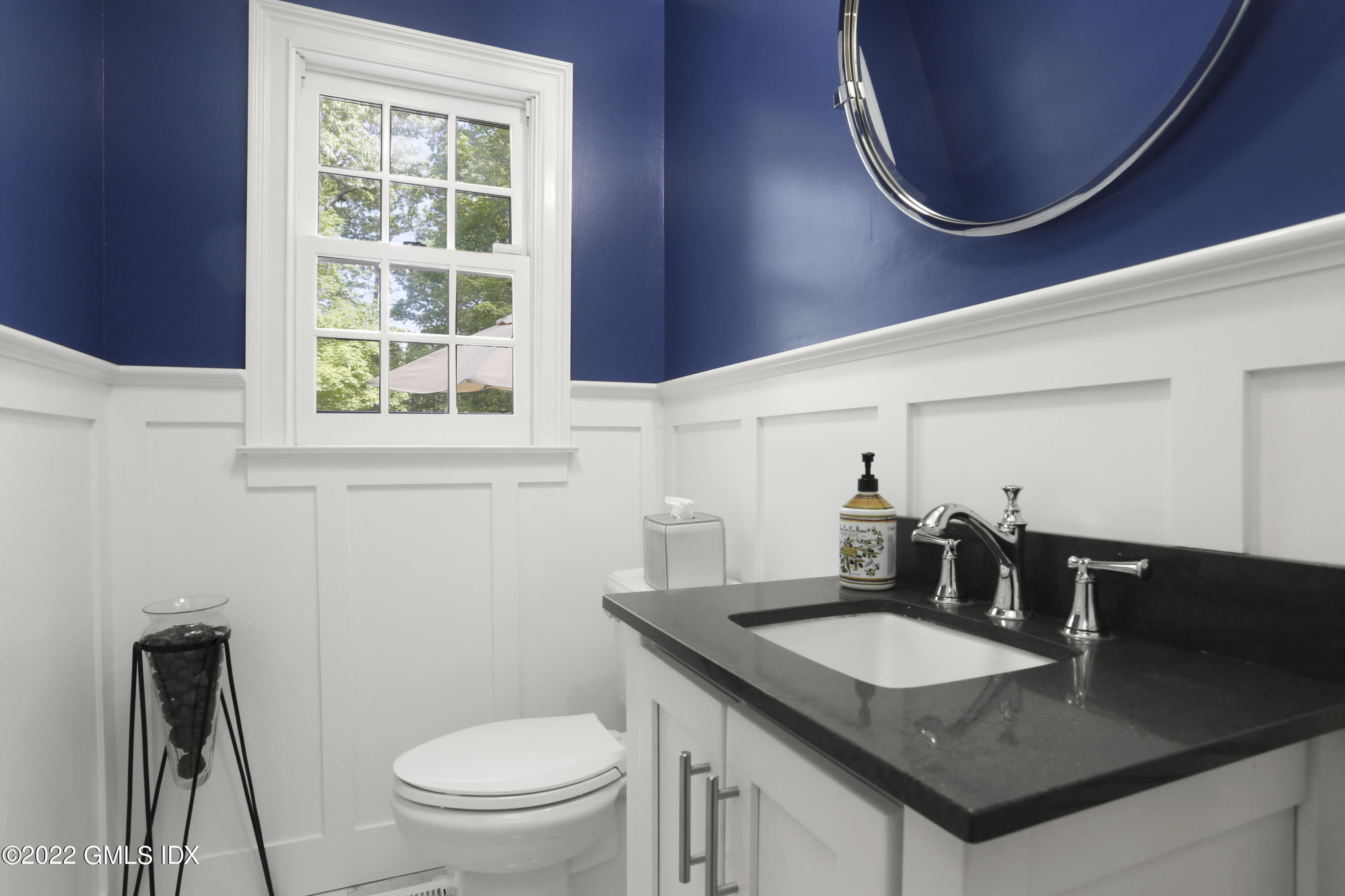 9 Frontier Road Cos Cob, CT 06807 - Photo 24 of 37 a bathroom with a granite countertop sink and a mirror