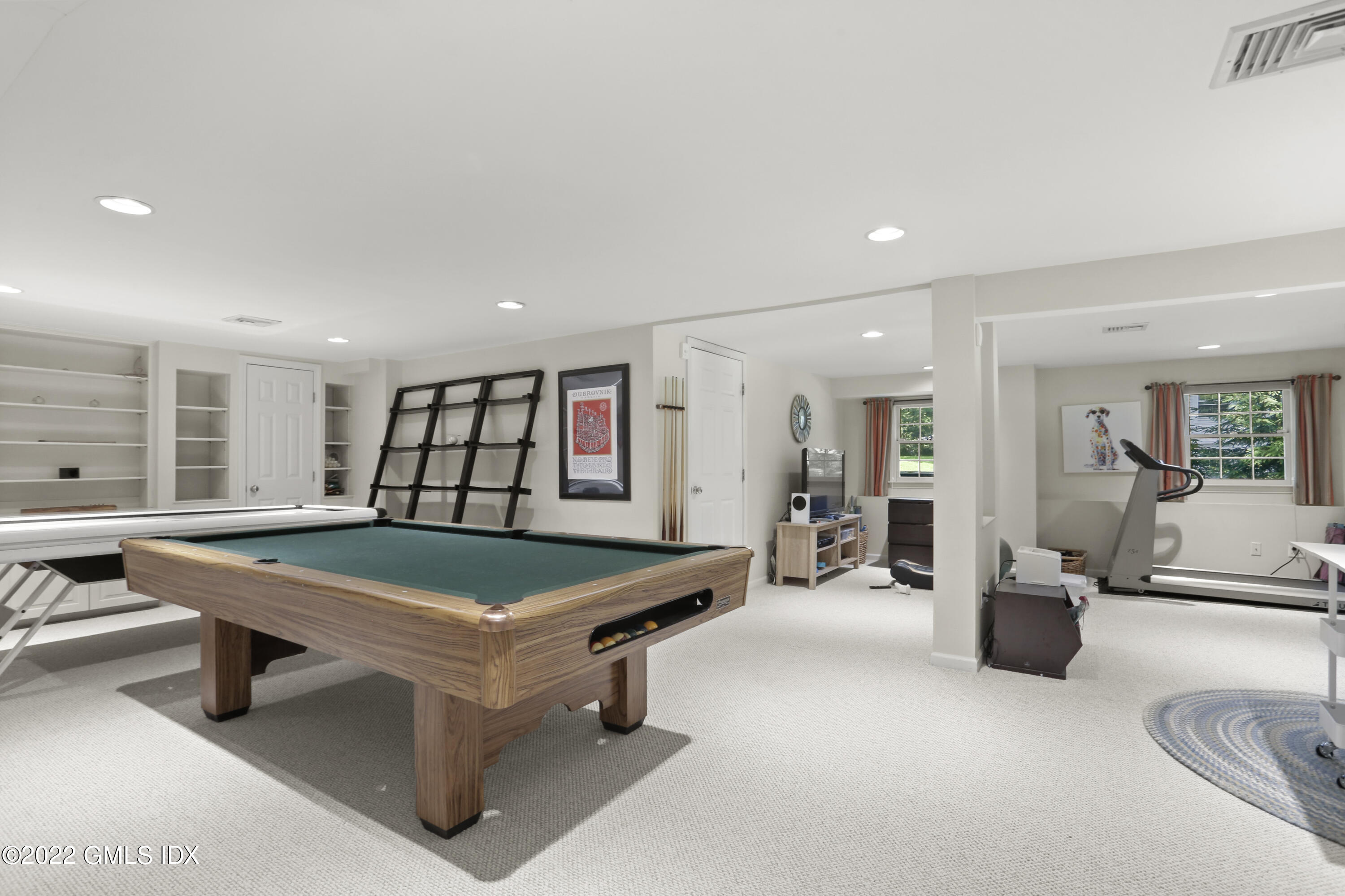 9 Frontier Road Cos Cob, CT 06807 - Photo 26 of 37 a room with furniture and air hockey table