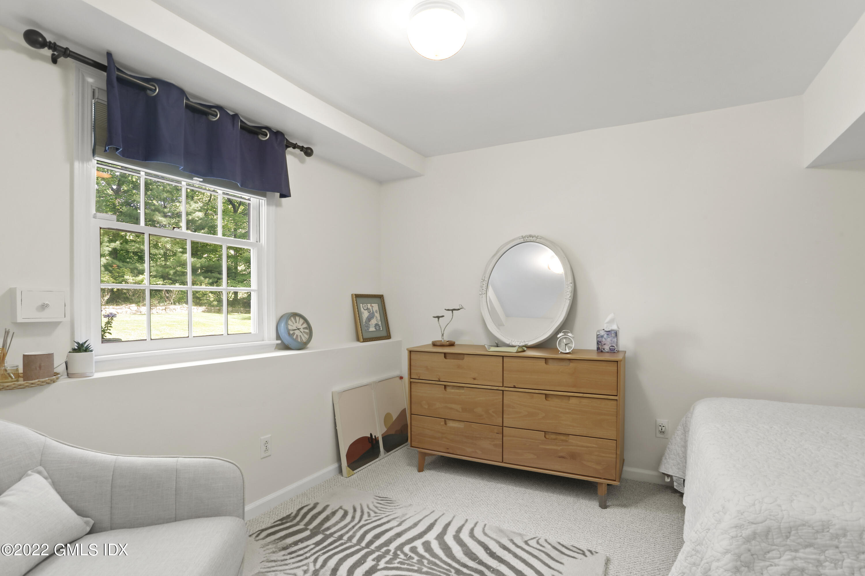9 Frontier Road Cos Cob, CT 06807 - Photo 28 of 37 a living room with furniture and a window