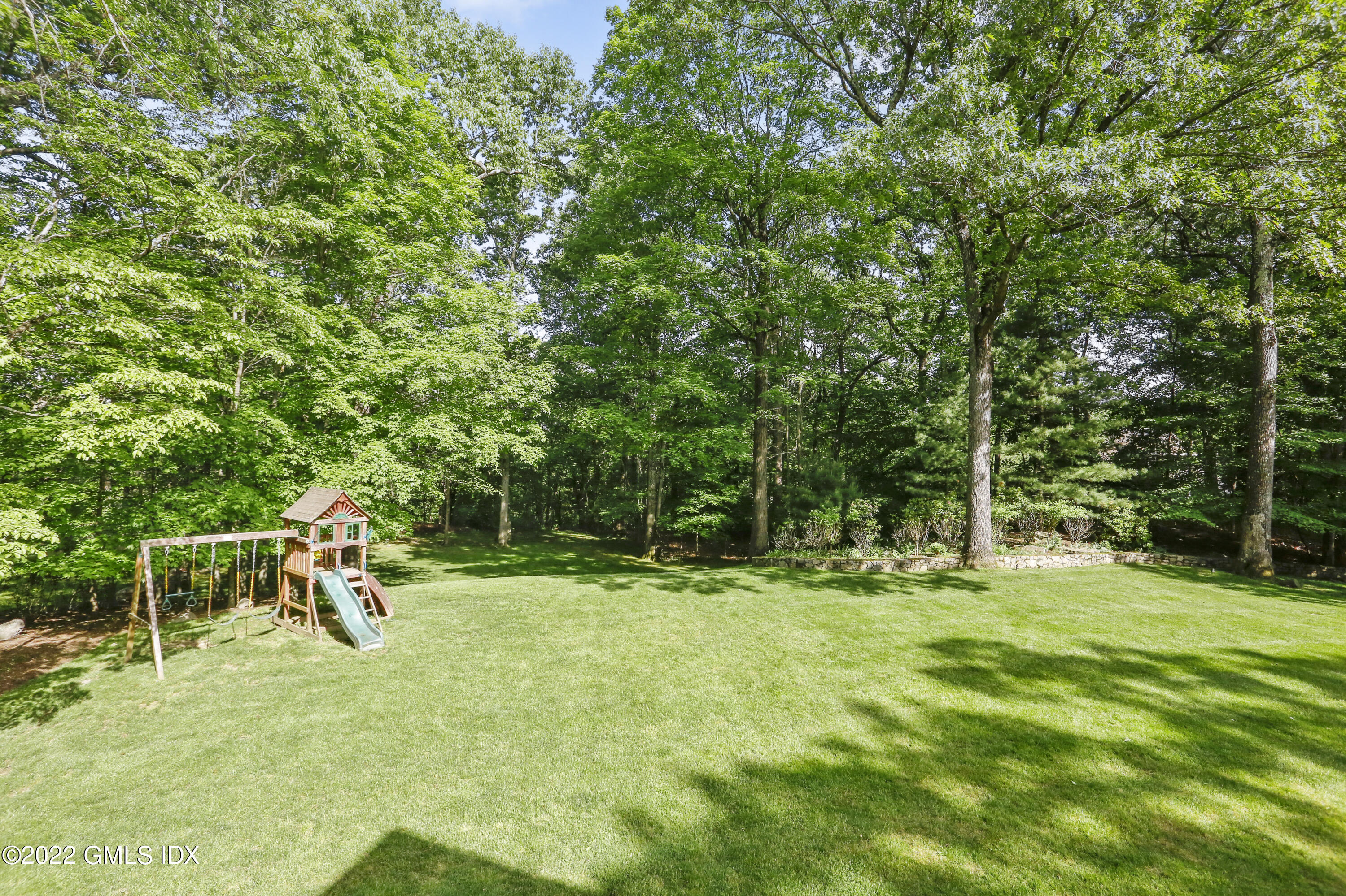9 Frontier Road Cos Cob, CT 06807 - Photo 31 of 37 a backyard of a house with trampoline