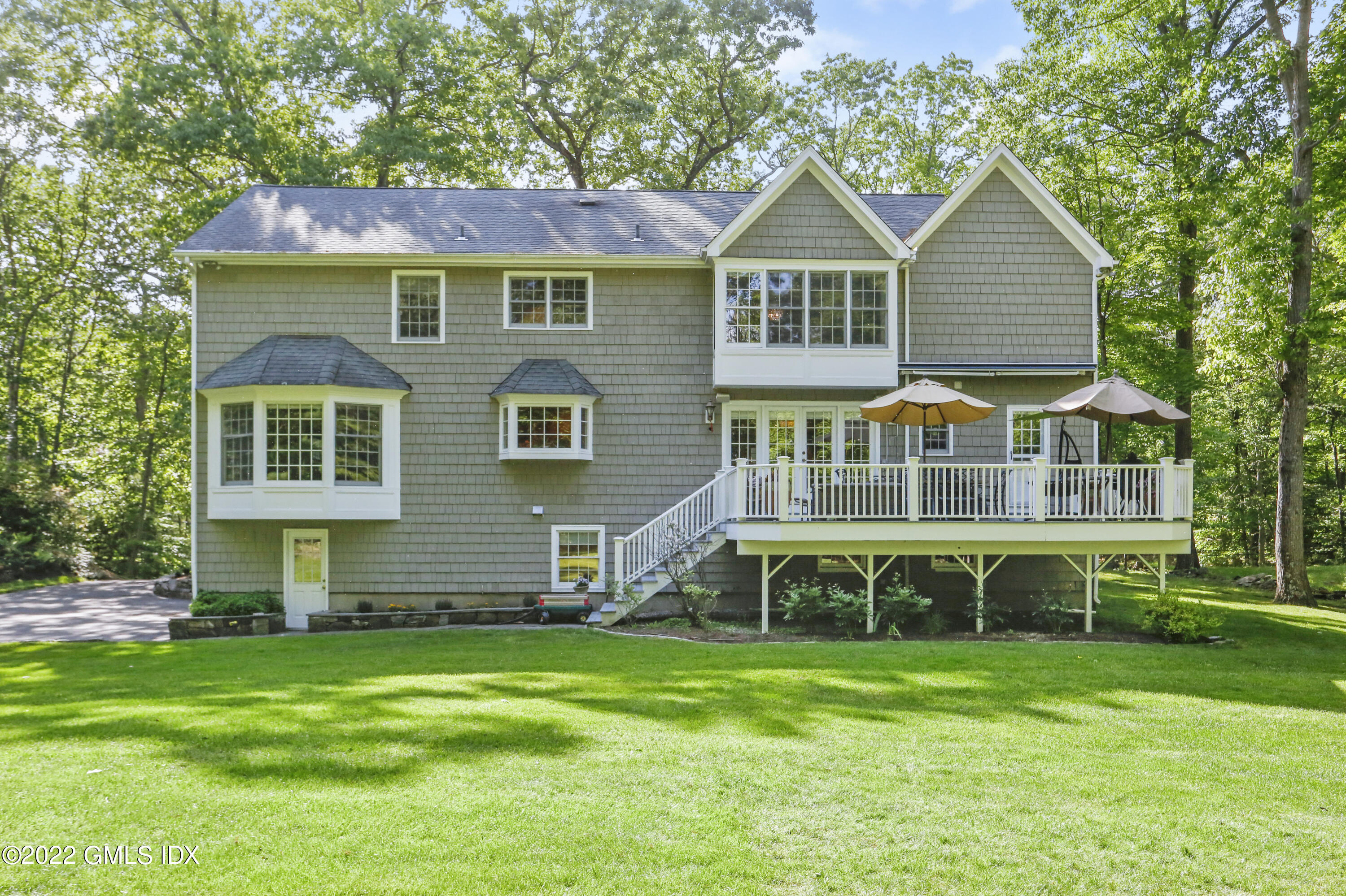9 Frontier Road Cos Cob, CT 06807 - Photo 33 of 37 a front view of a house with a yard