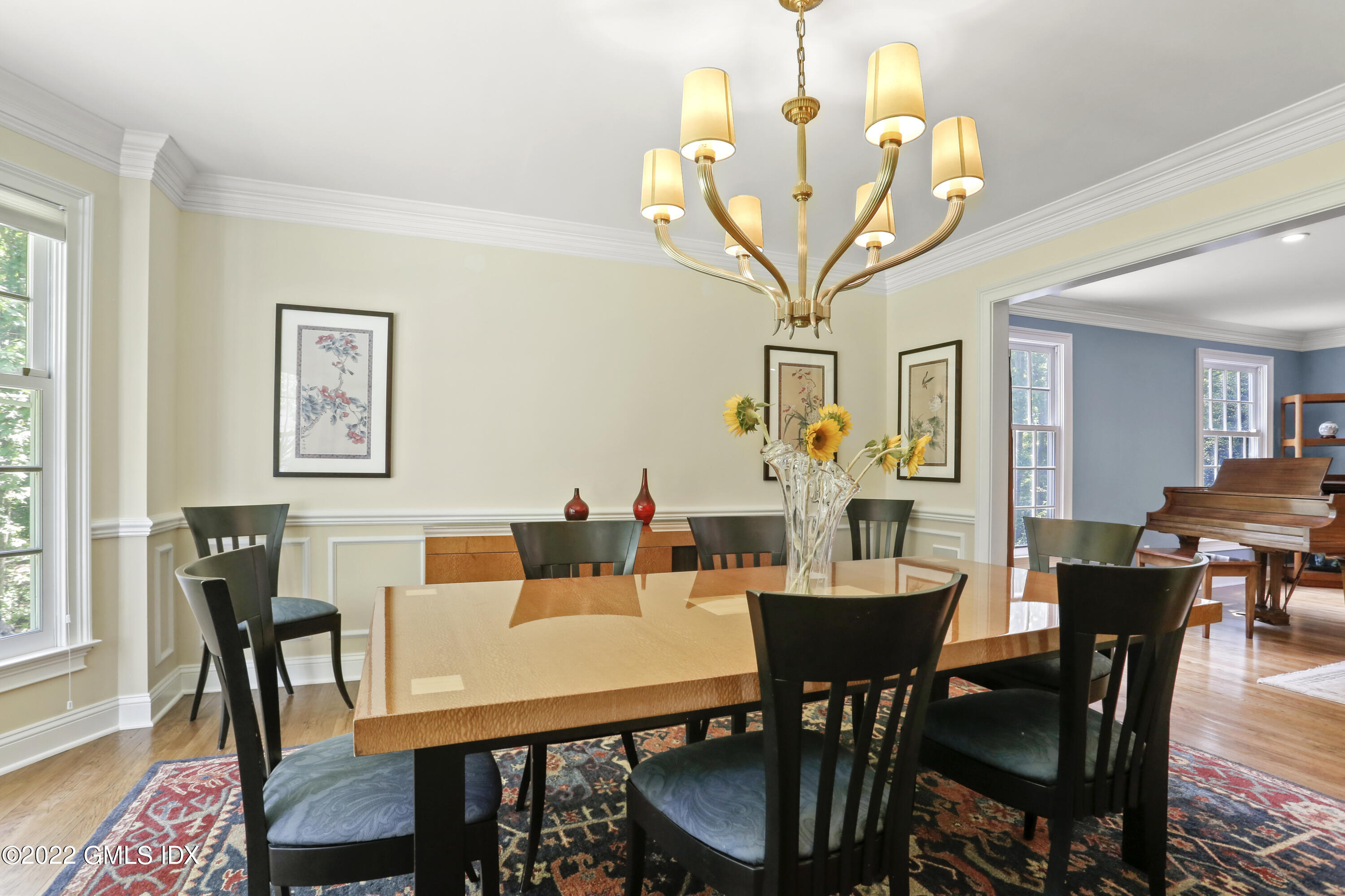 9 Frontier Road Cos Cob, CT 06807 - Photo 7 of 37 a view of a dining room with furniture and wooden floor