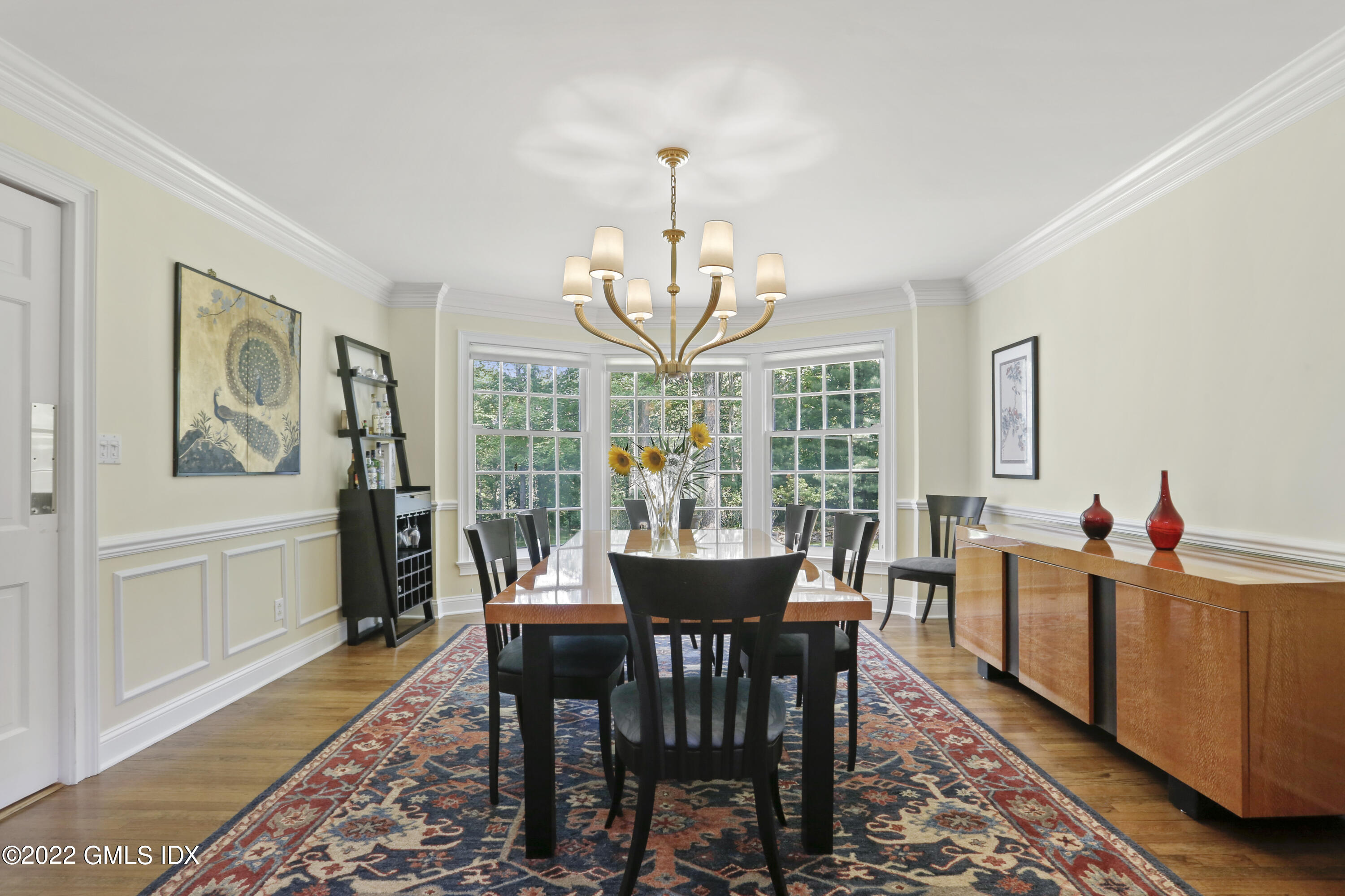 9 Frontier Road Cos Cob, CT 06807 - Photo 8 of 37 a view of a dining room with furniture window and wooden floor