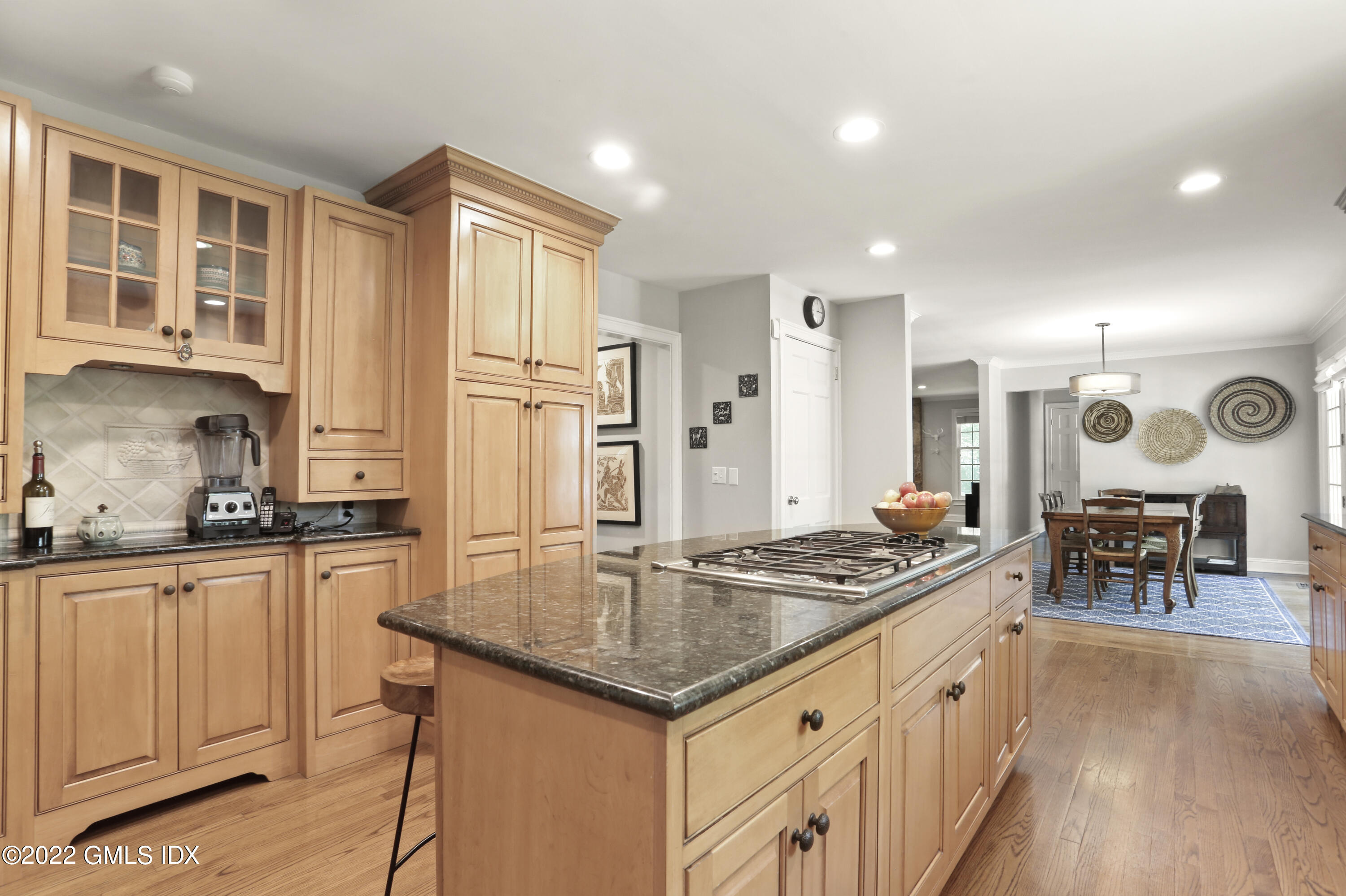 9 Frontier Road Cos Cob, CT 06807 - Photo 9 of 37 a kitchen with stainless steel appliances granite countertop a stove top oven a sink dishwasher and white cabinets with wooden floor