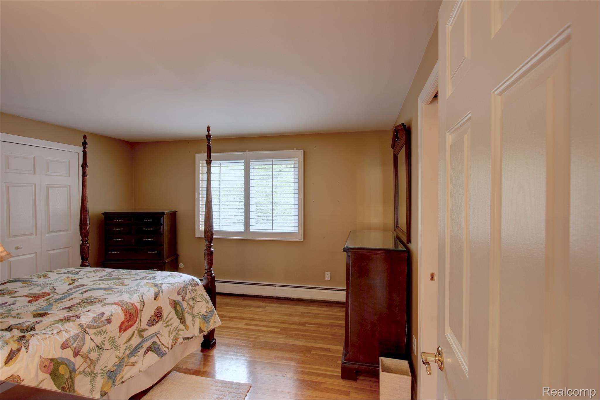 19380 Savage Road Belleville, MI 48111 - Photo 73 of 99 TASTEFUL, NEUTRAL MASTER BEDROOM WITH ENSUITE, OVERLOOKING THE BACK ACREAGE
