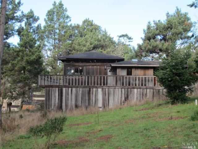 a view of a backyard with a small cabin