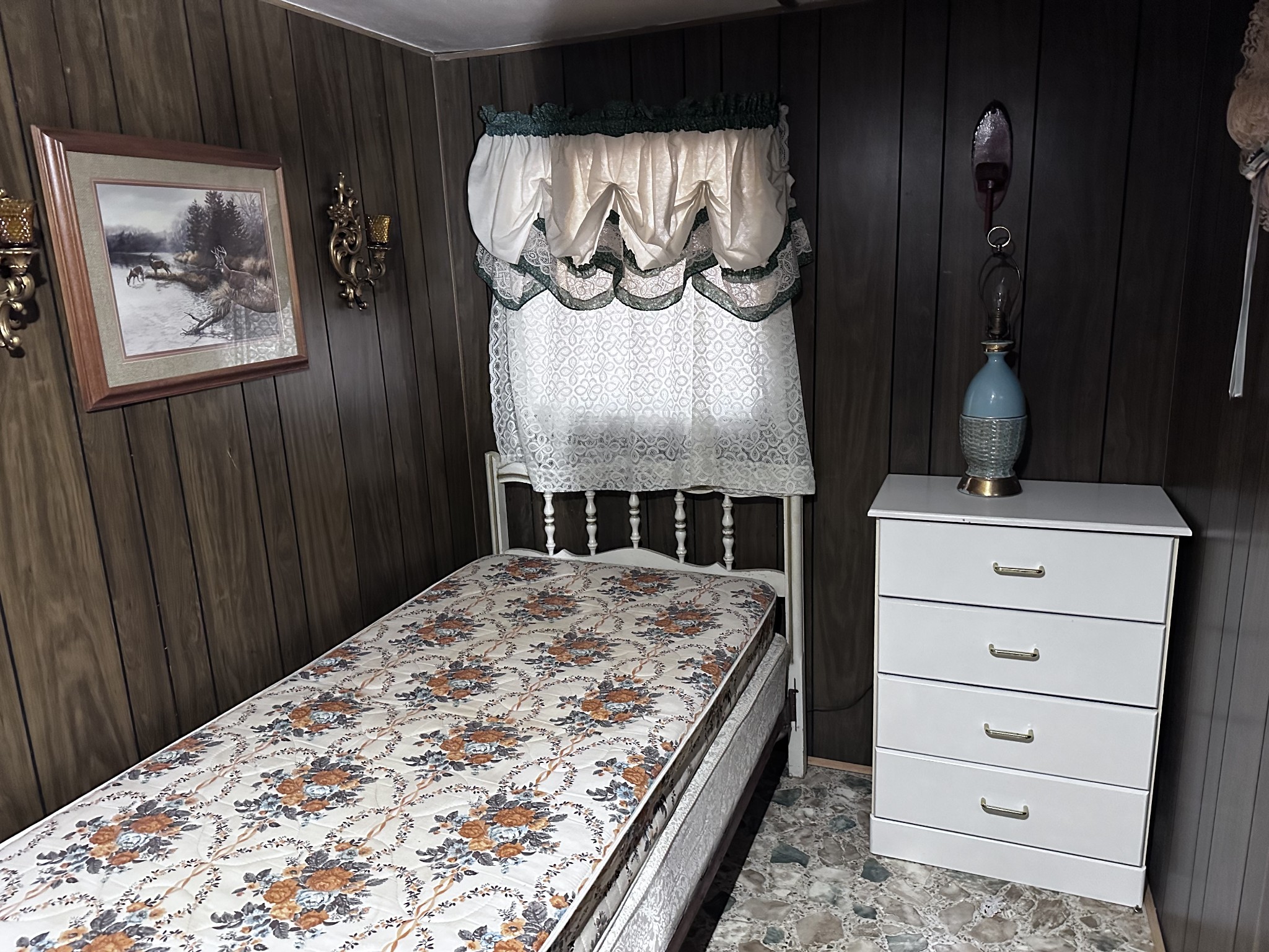 4386 Cumberland City Road Indian Mound, TN 37079 - Photo 14 of 14 a bed in a bedroom and a mirror