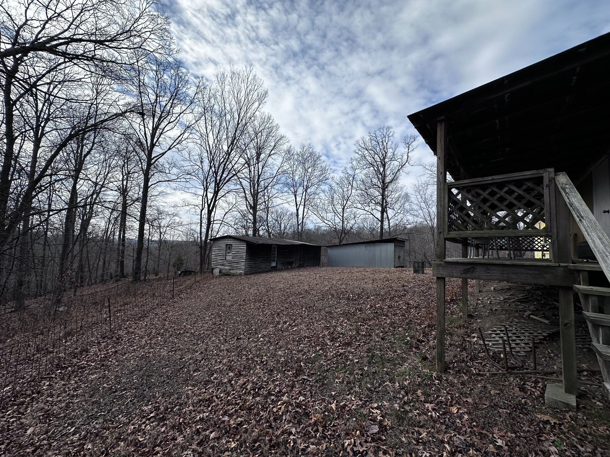 4386 Cumberland City Road Indian Mound, TN 37079 - Photo 2 of 14 a view of backyard with wooden fence