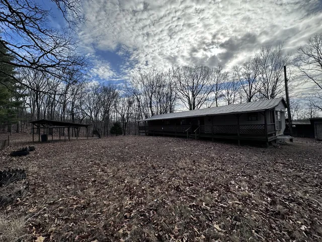 a view of backyard with green space