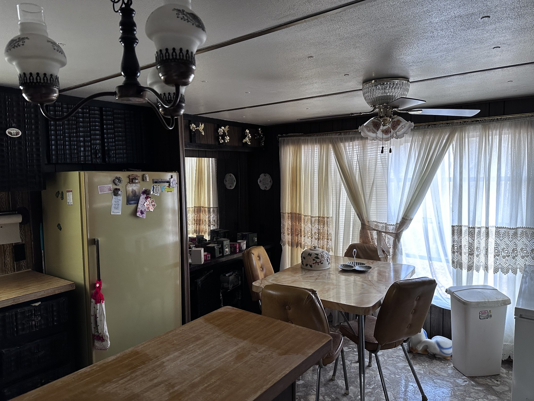 4386 Cumberland City Road Indian Mound, TN 37079 - Photo 9 of 14 a kitchen with stainless steel appliances granite countertop sink refrigerator table and chairs