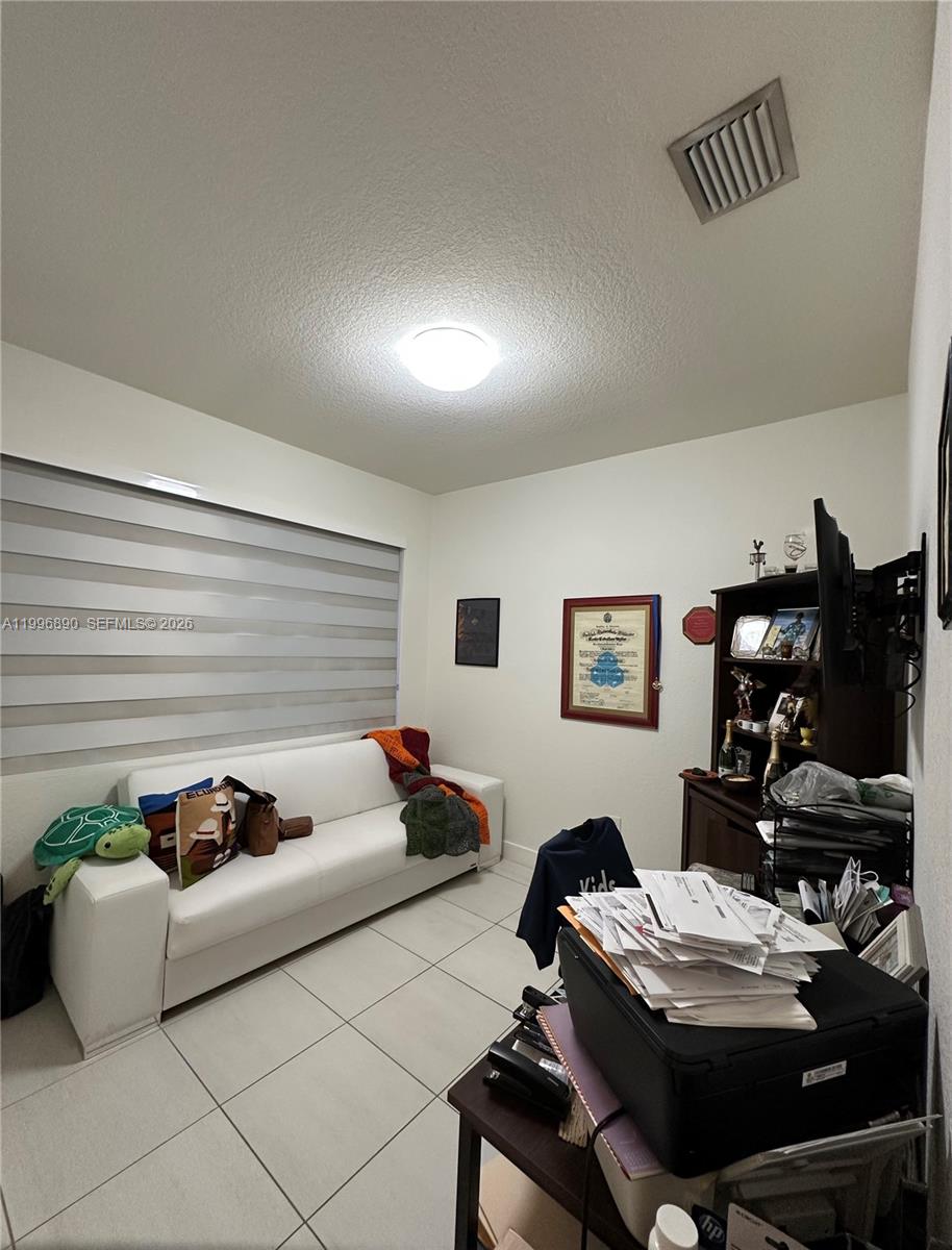 23552 Southwest 107th Place Homestead, FL 33032 - Photo 18 of 30 a workspace with furniture and window