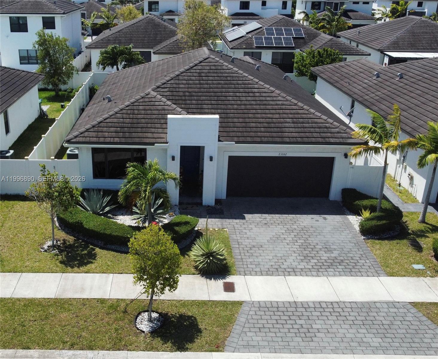 23552 Southwest 107th Place Homestead, FL 33032 - Photo 2 of 30 a front view of a house with a yard