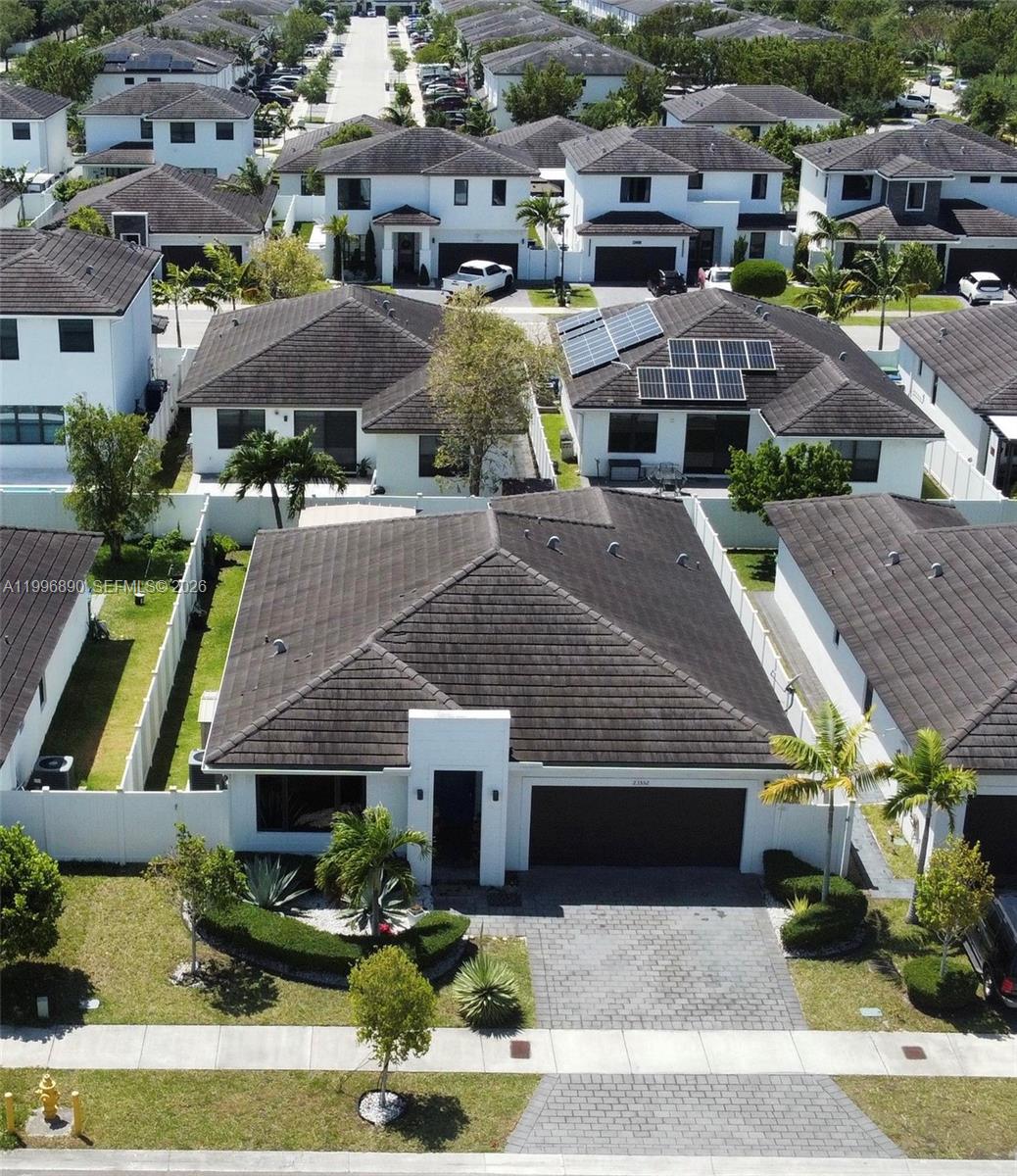 23552 Southwest 107th Place Homestead, FL 33032 - Photo 3 of 30 an aerial view of multiple houses with a yard