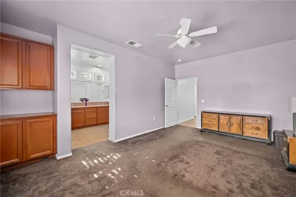a spacious bathroom with a double vanity sink and a mirror