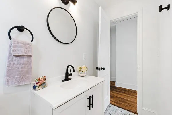 a bathroom with a sink and a mirror