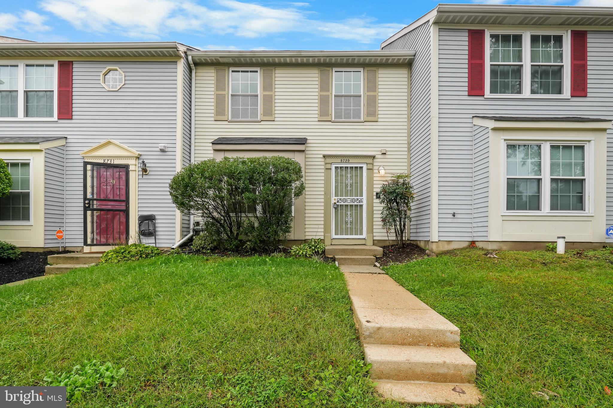 front view of a house with a yard