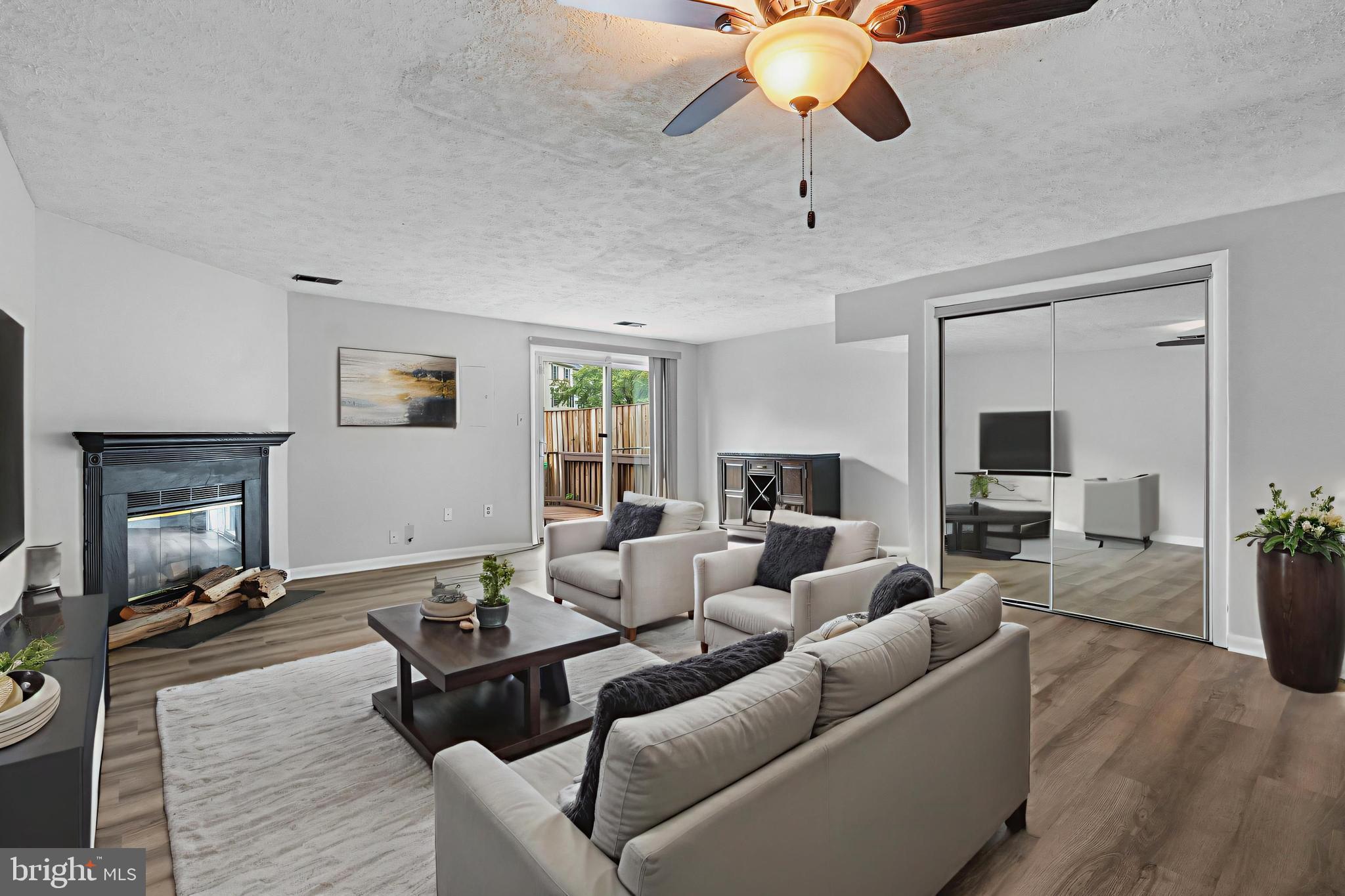 a living room with furniture or couch and a fireplace