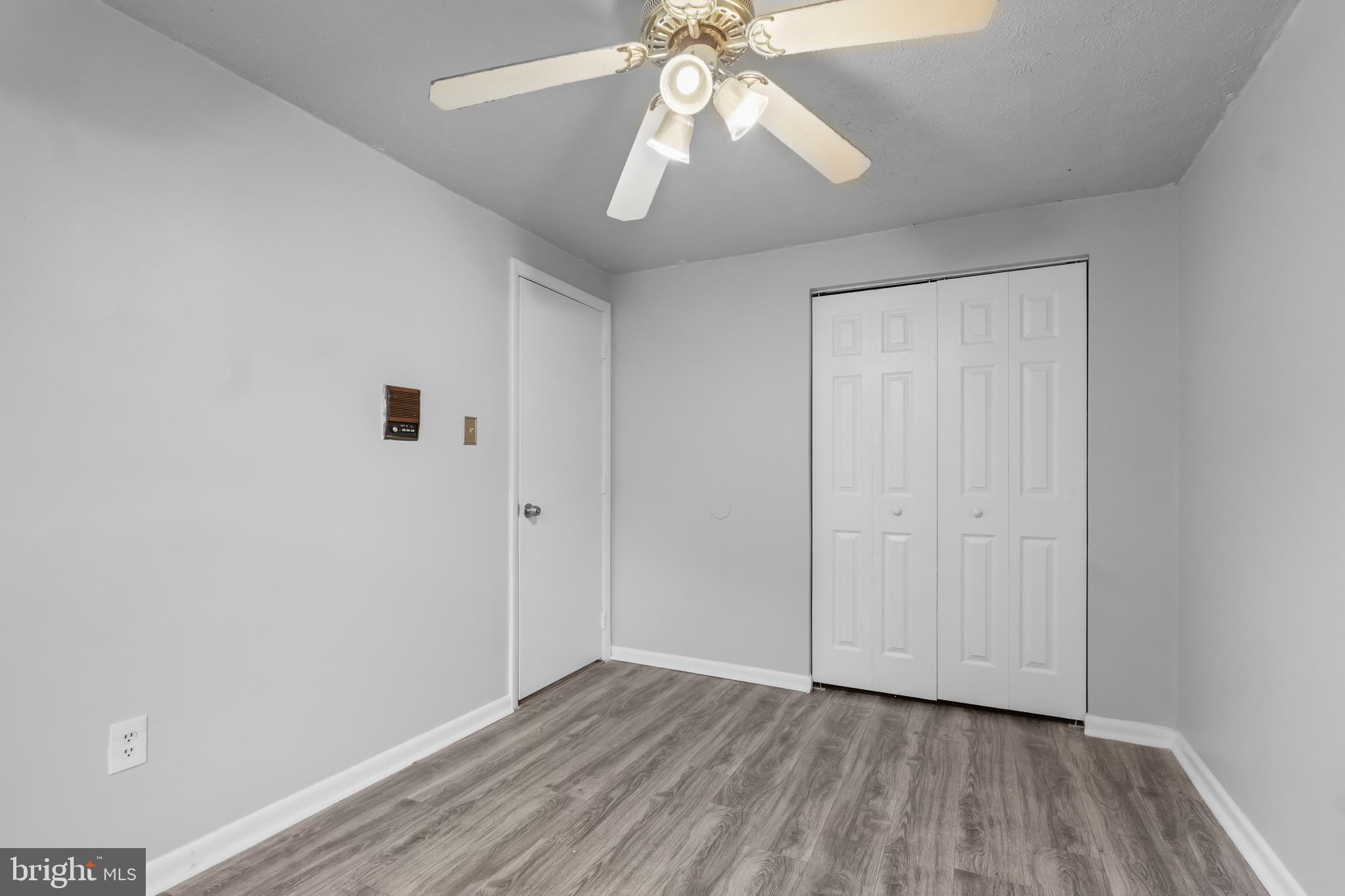 8729 Ritchboro Road District Heights, MD 20747 - Photo 16 of 22 a view of an empty room with wooden floor