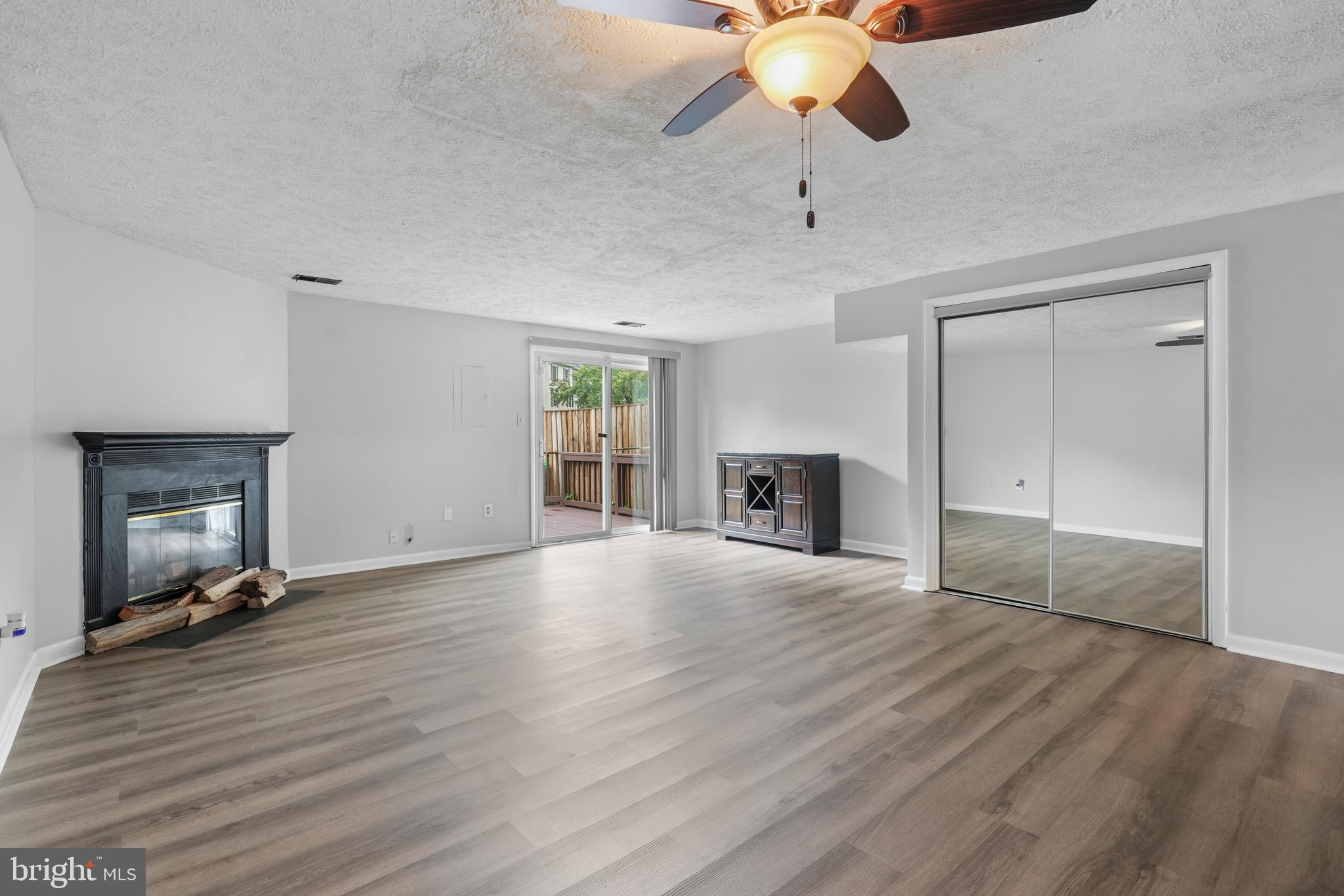 8729 Ritchboro Road District Heights, MD 20747 - Photo 8 of 22 a view of an empty room with window and wooden floor