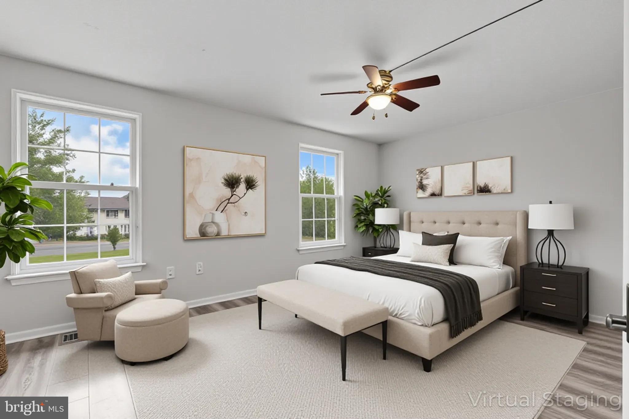 8729 Ritchboro Road District Heights, MD 20747 - Photo 10 of 22 a bedroom with a bed and a chandelier