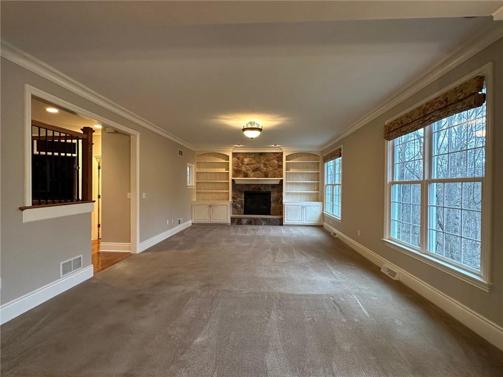 235 Stoup Road Mars, PA 16046 - Photo 15 of 50 a view of a livingroom with an empty space and a fireplace