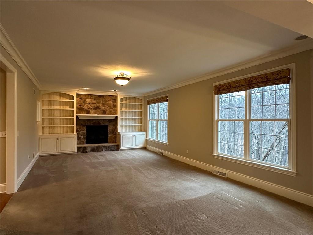235 Stoup Road Mars, PA 16046 - Photo 16 of 50 an empty room with furniture and a fireplace