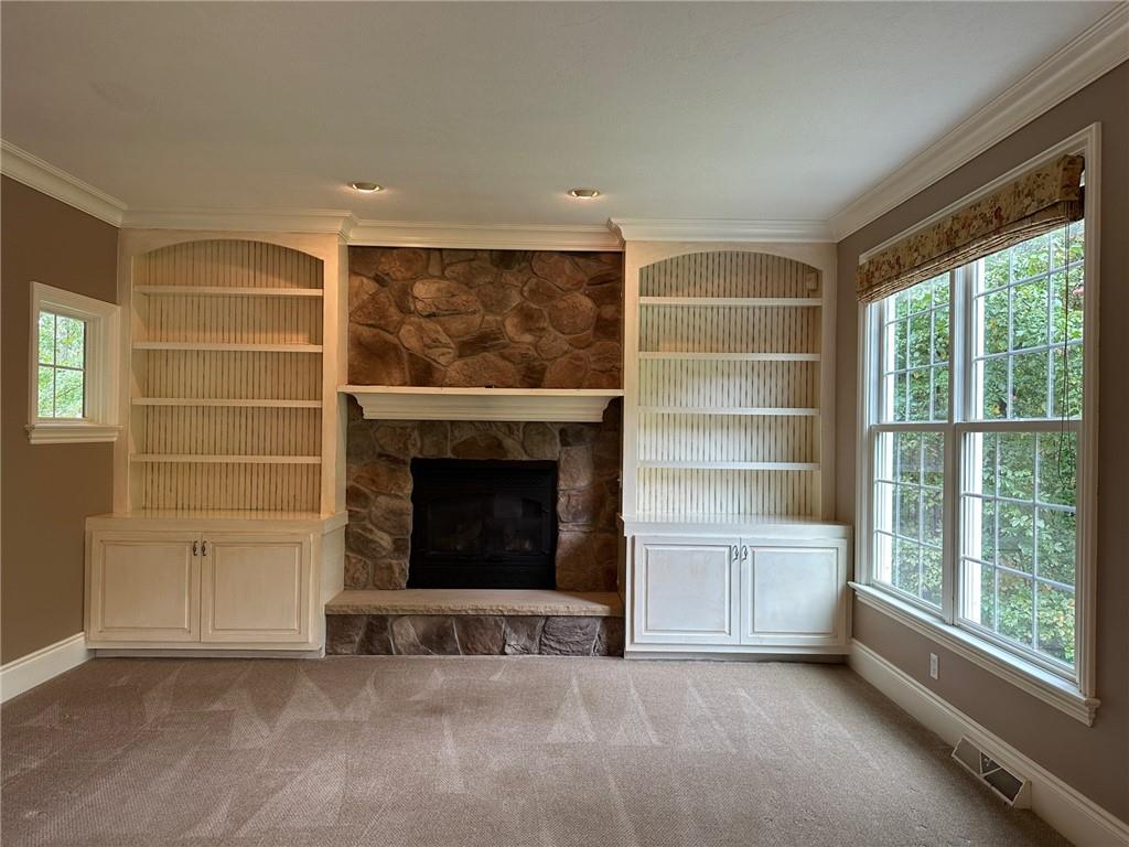 235 Stoup Road Mars, PA 16046 - Photo 17 of 50 a view of an empty room with a fireplace and a window