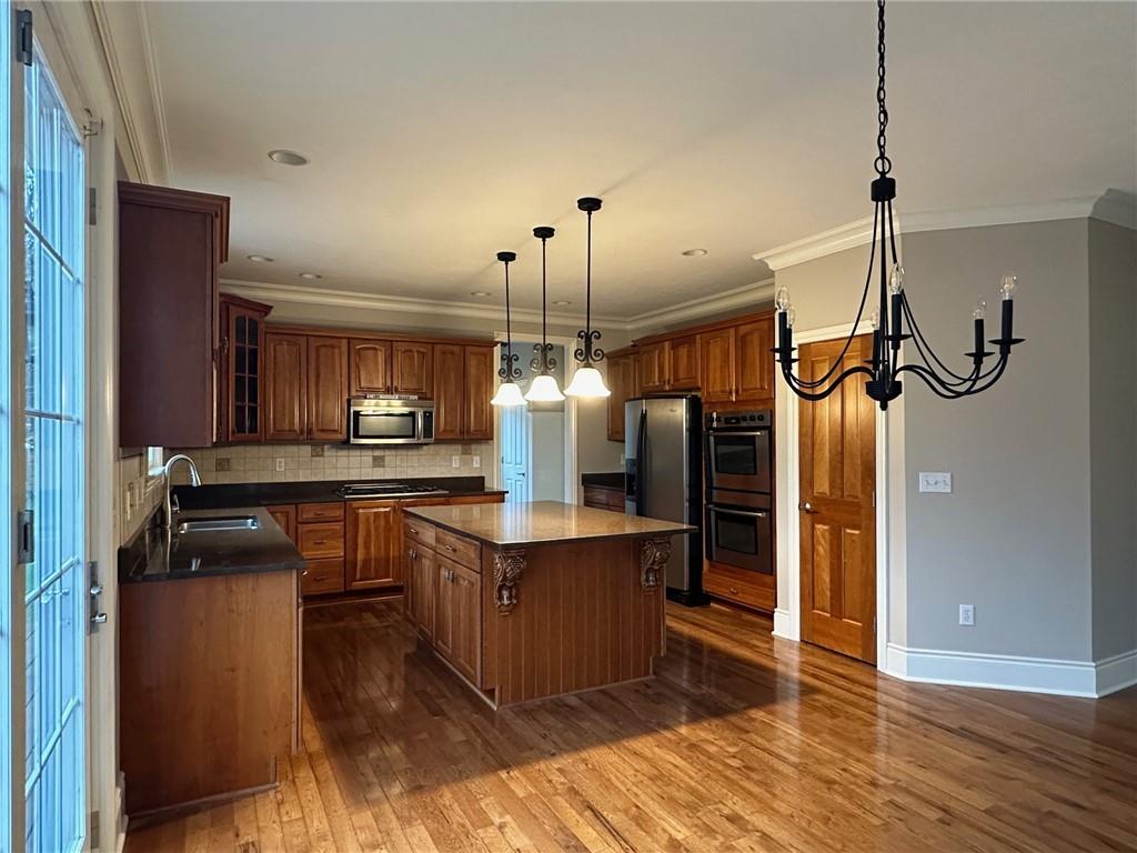 235 Stoup Road Mars, PA 16046 - Photo 21 of 50 a kitchen with kitchen island a counter top space a sink appliances and cabinets